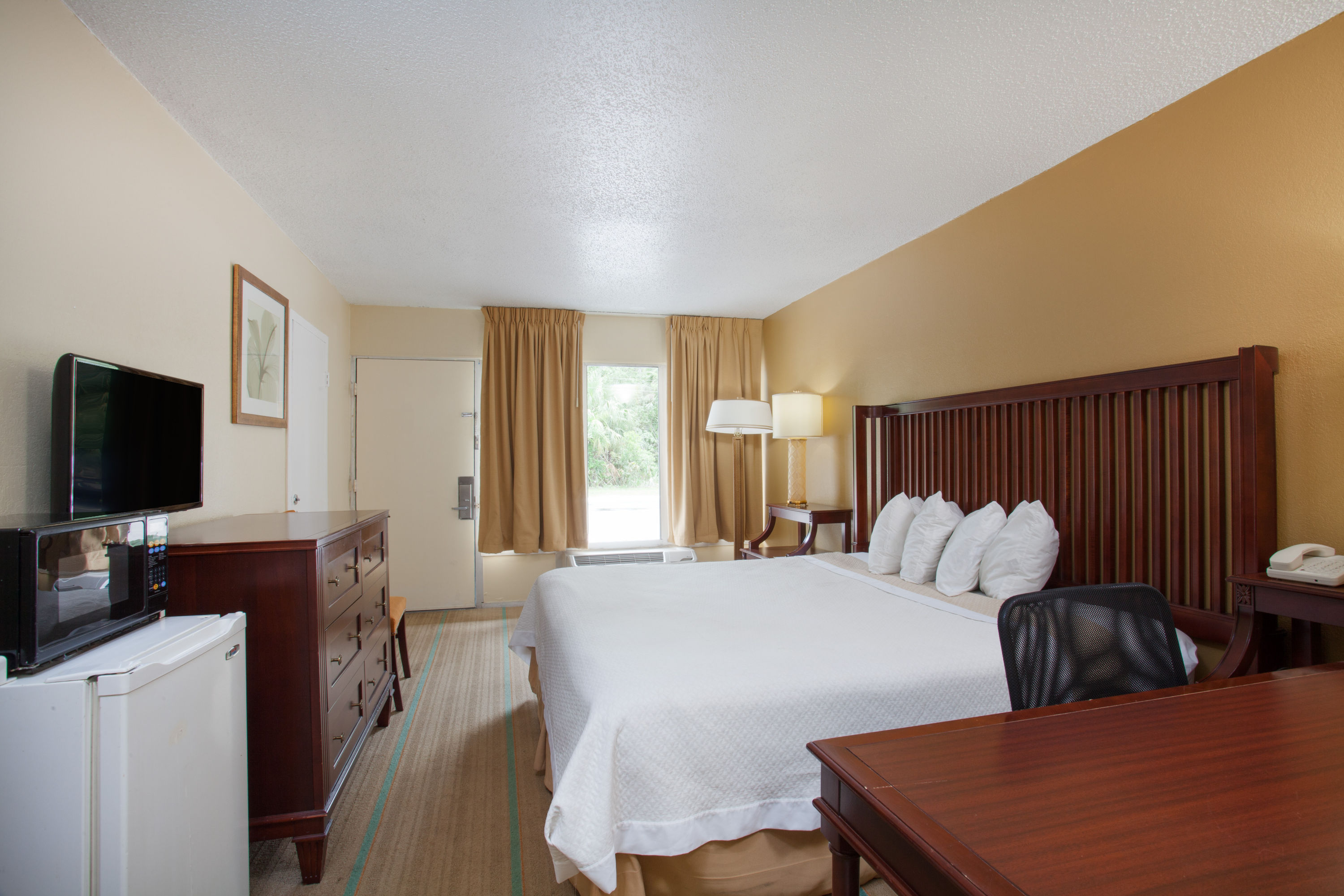 Guest room at the Days Inn by Wyndham Daytona Beach Speedway in Daytona Beach, Florida