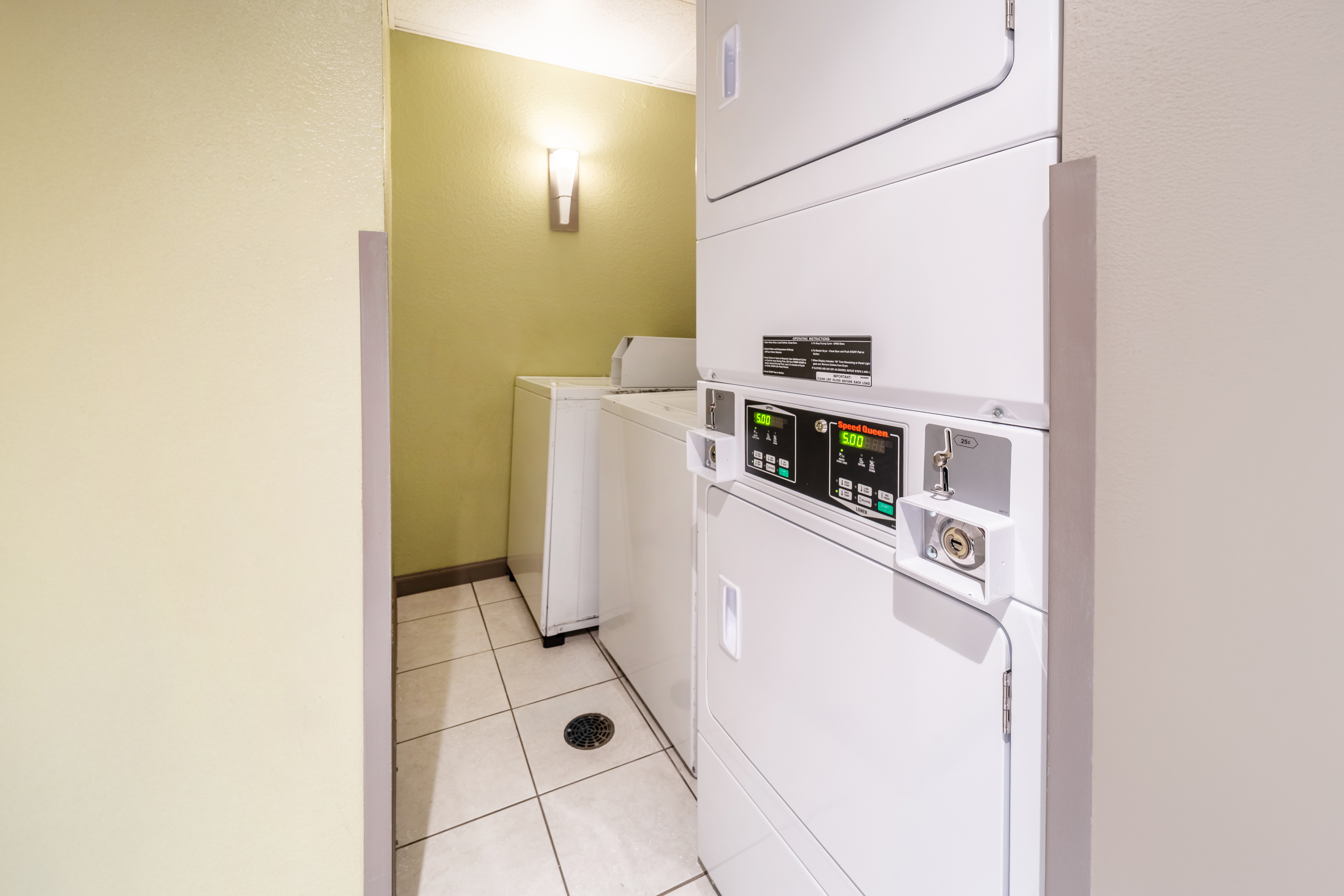 Laundry facilities at Days Inn & Suites by Wyndham Fort Myers Near JetBlue Park in Fort Myers, Florida