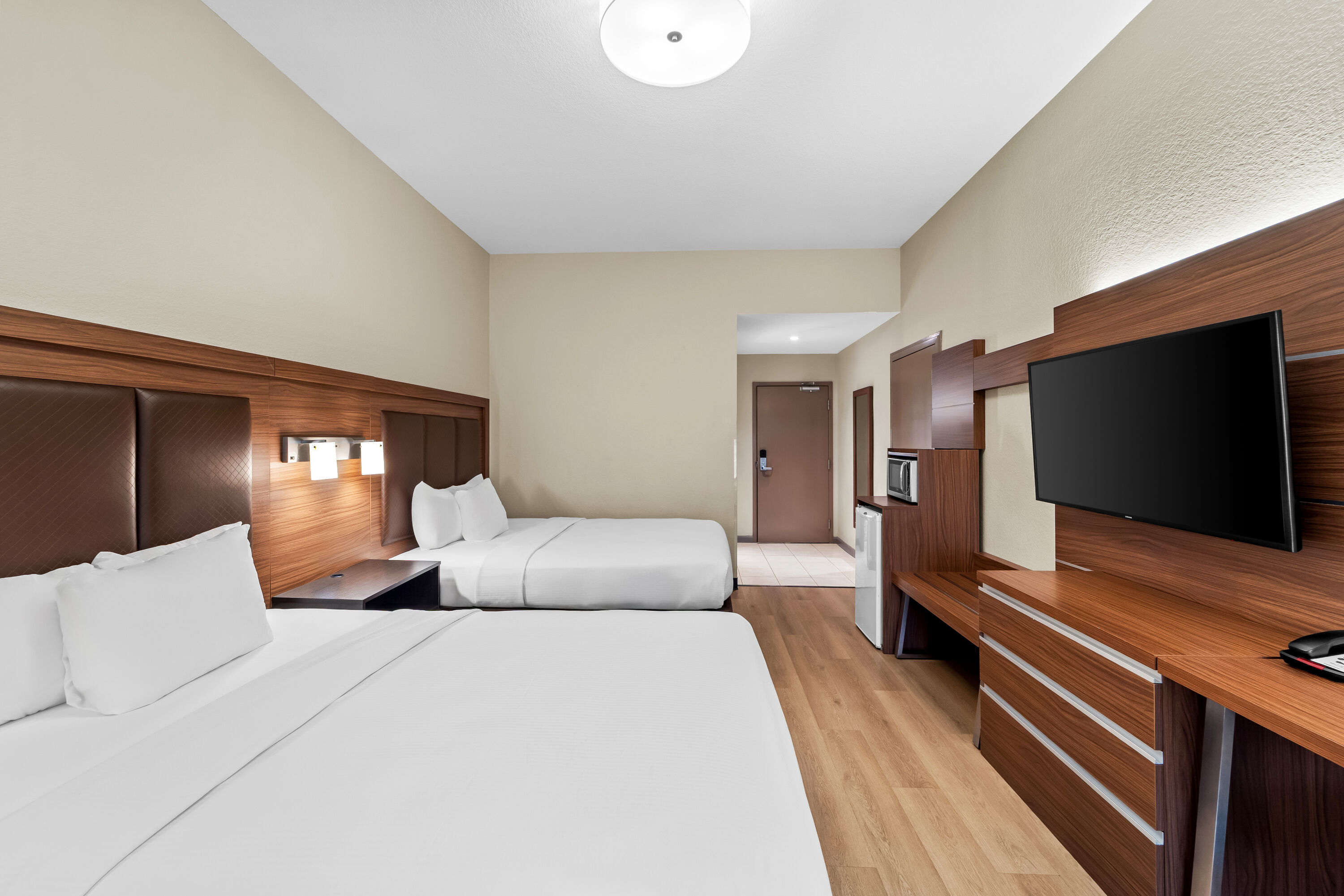 Double bed guest room at the Days Inn & Suites by Wyndham Fort Myers Near JetBlue Park in Fort Myers, Florida