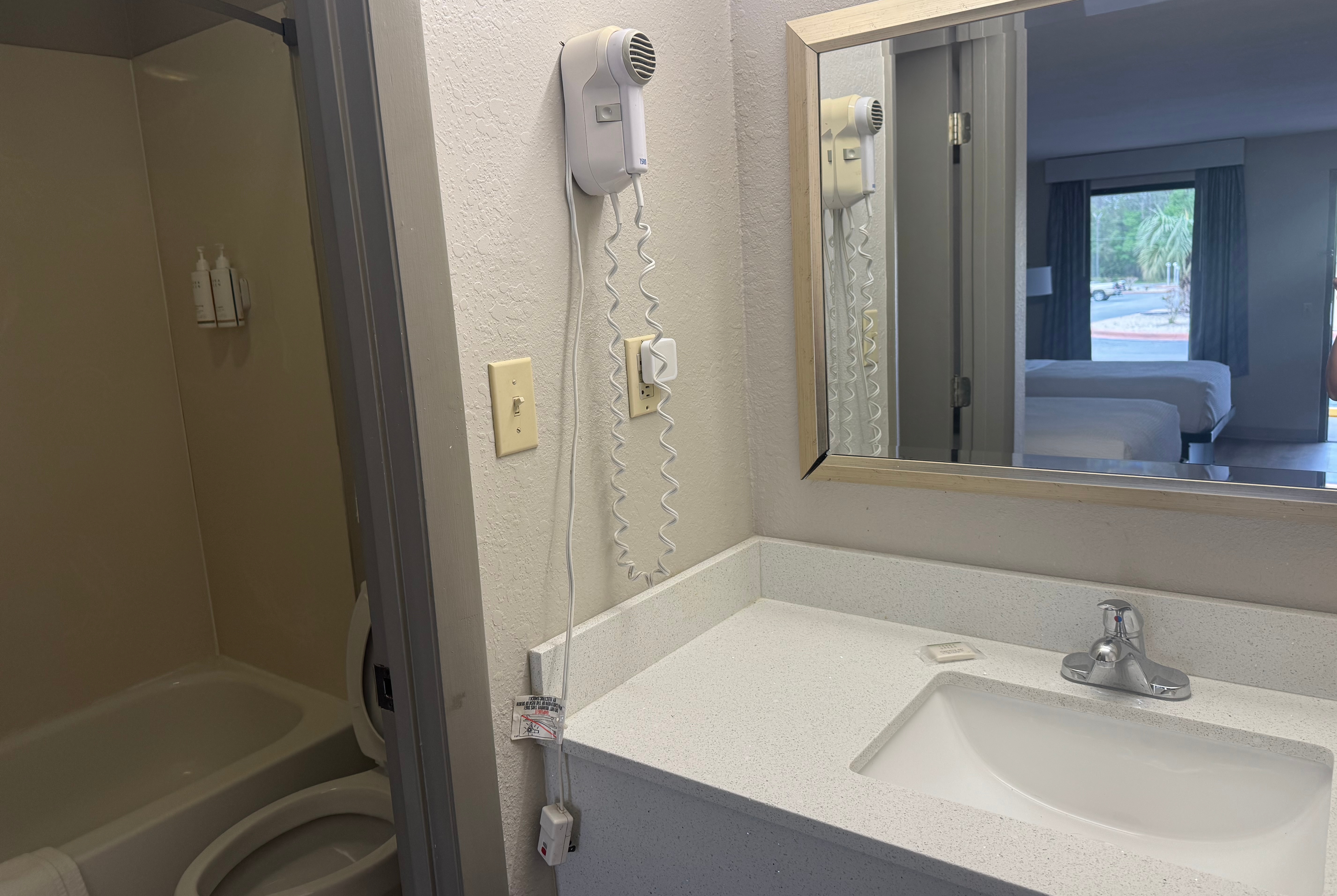 Guest room bath at the Days Inn by Wyndham Lake City I-10 in Lake City, Florida