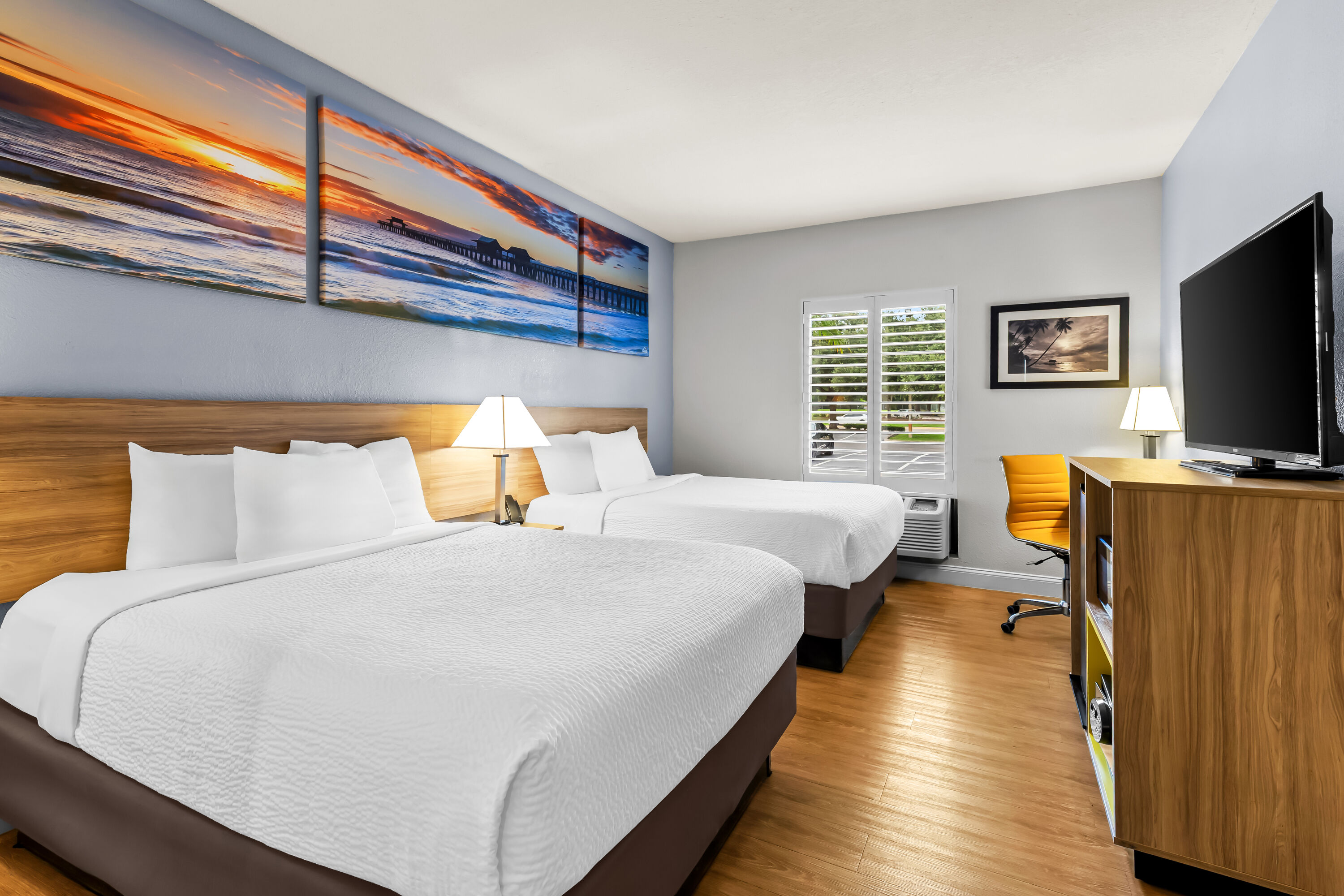 Double bed guest room at the Days Inn & Suites by Wyndham Lakeland in Lakeland, Florida