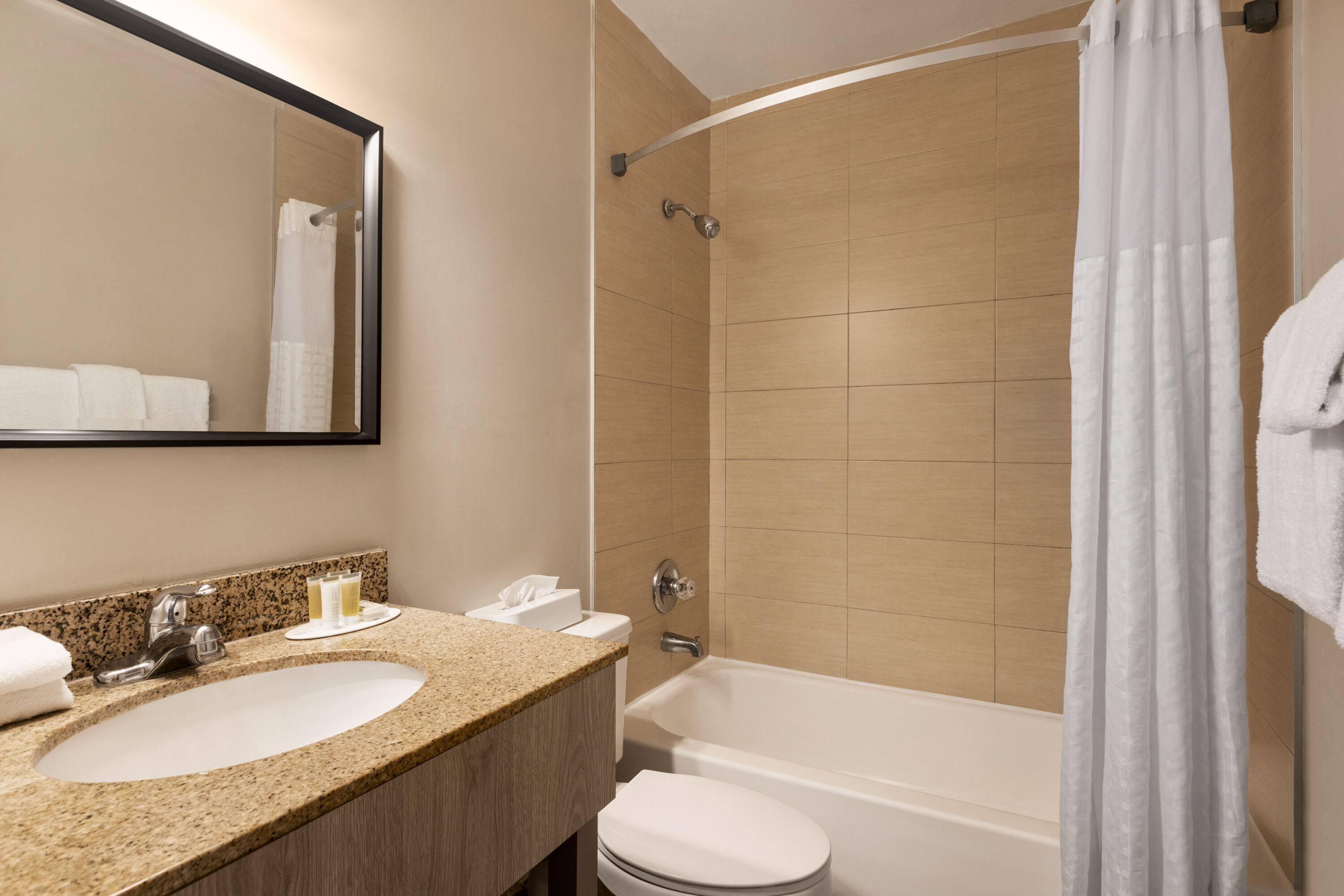 Guest room bath at the Days Inn by Wyndham Miami Airport North in Miami, Florida