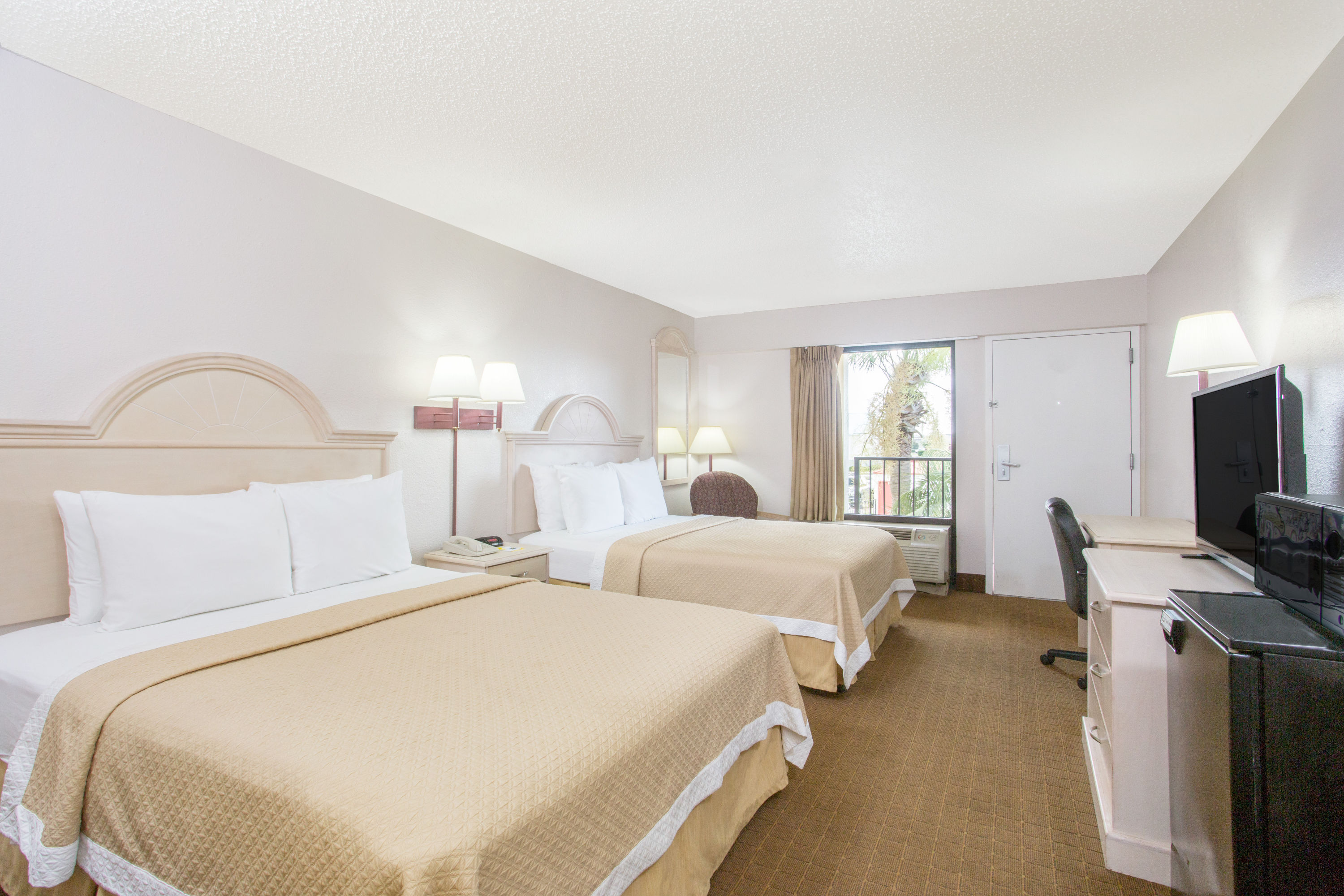 Guest room at the Days Inn & Suites by Wyndham Navarre - near Beaches/Hurlburt in Navarre, Florida