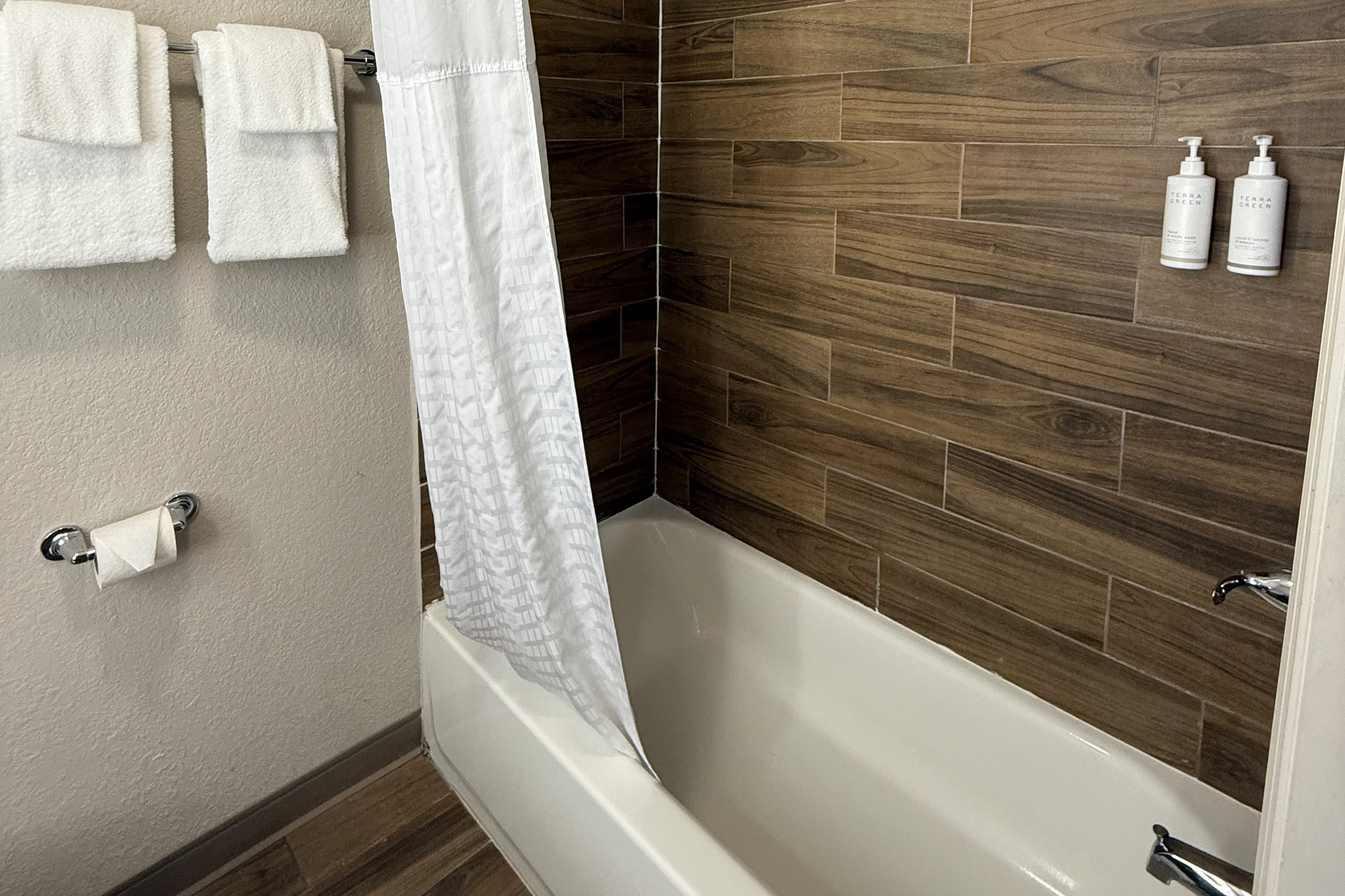 Guest room bath at the Days Inn by Wyndham Ocala North in Ocala, Florida