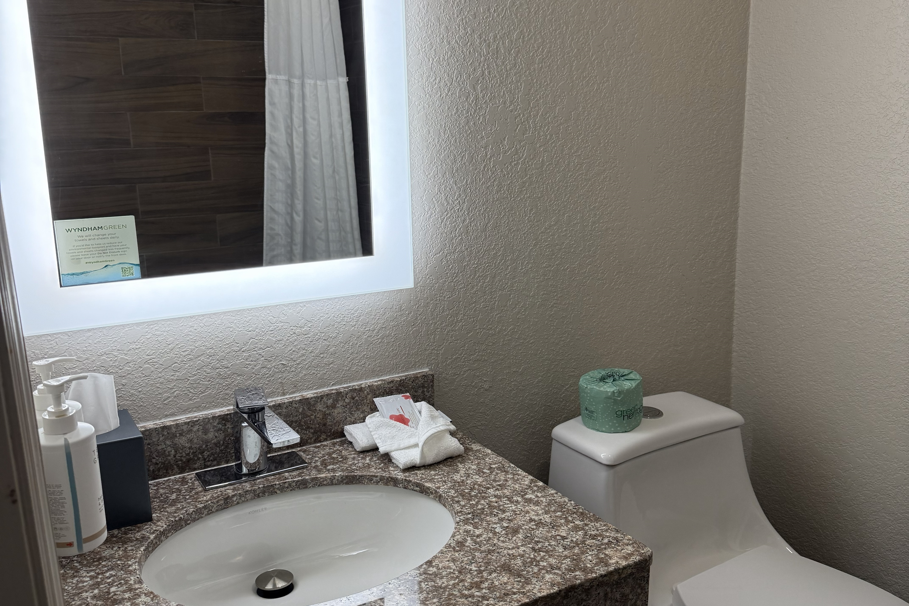 Guest room bath at the Days Inn by Wyndham Ocala North in Ocala, Florida