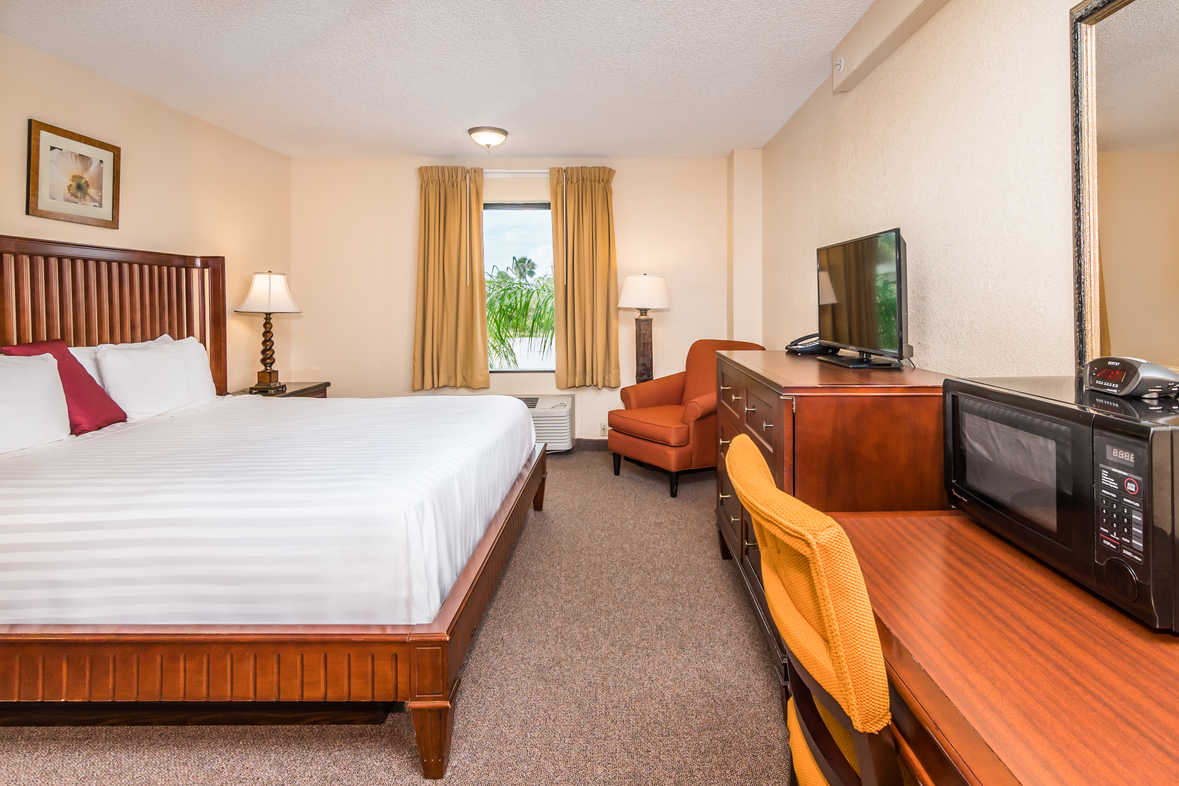 Guest room at the Days Inn & Suites by Wyndham Lake Okeechobee in Okeechobee, Florida