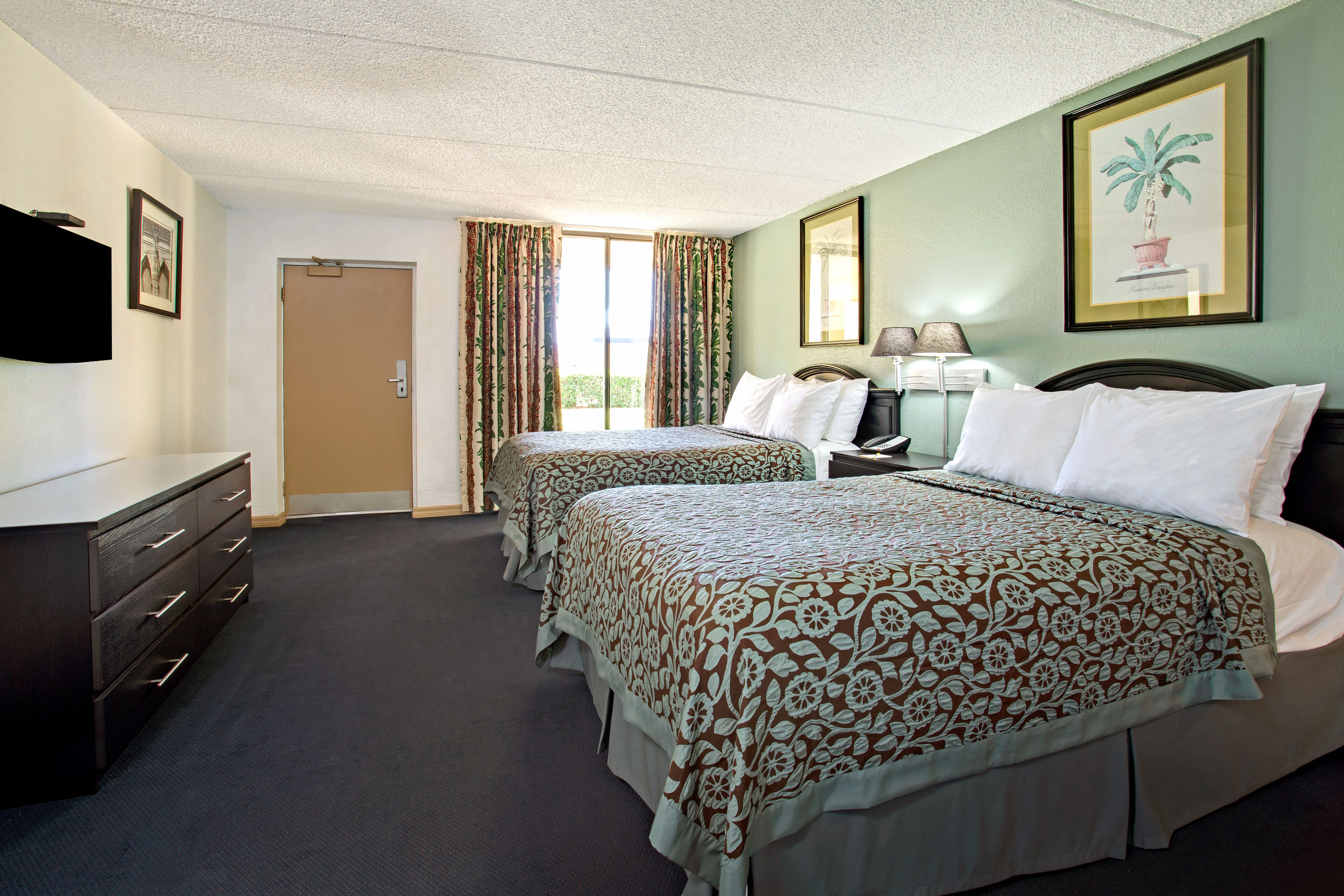 Guest room at the Days Inn by Wyndham Orlando Airport Florida Mall in Orlando, Florida