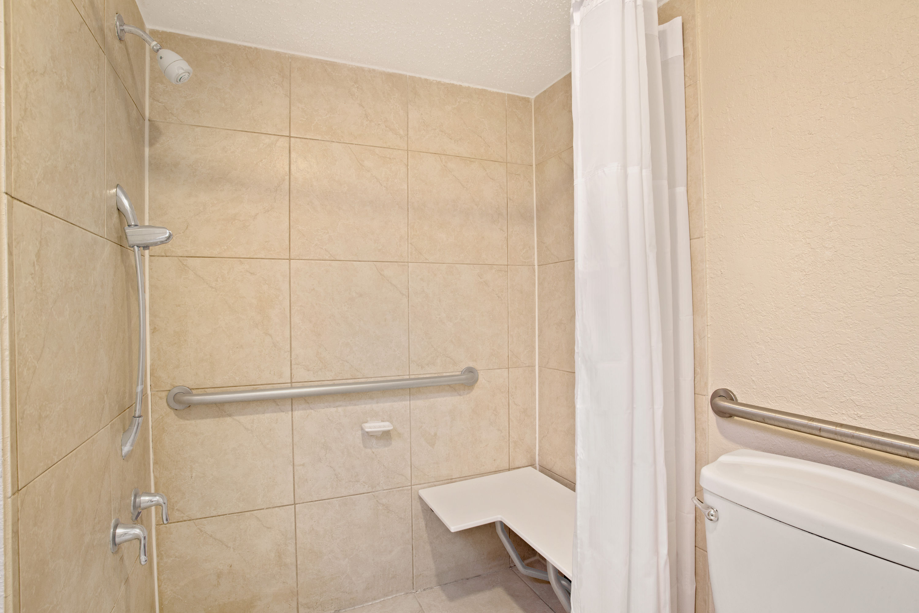 Guest room at the Days Inn by Wyndham Orlando Airport Florida Mall in Orlando, Florida