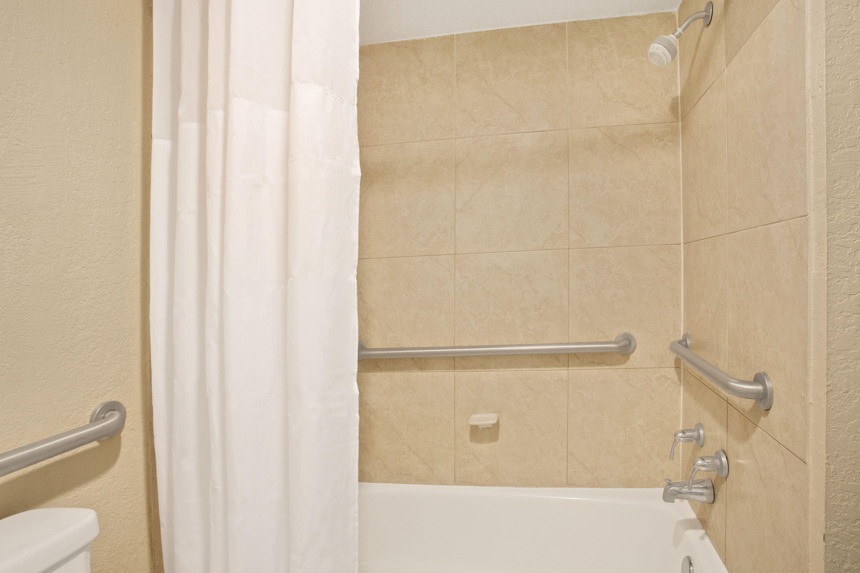 Guest room at the Days Inn by Wyndham Orlando Airport Florida Mall in Orlando, Florida