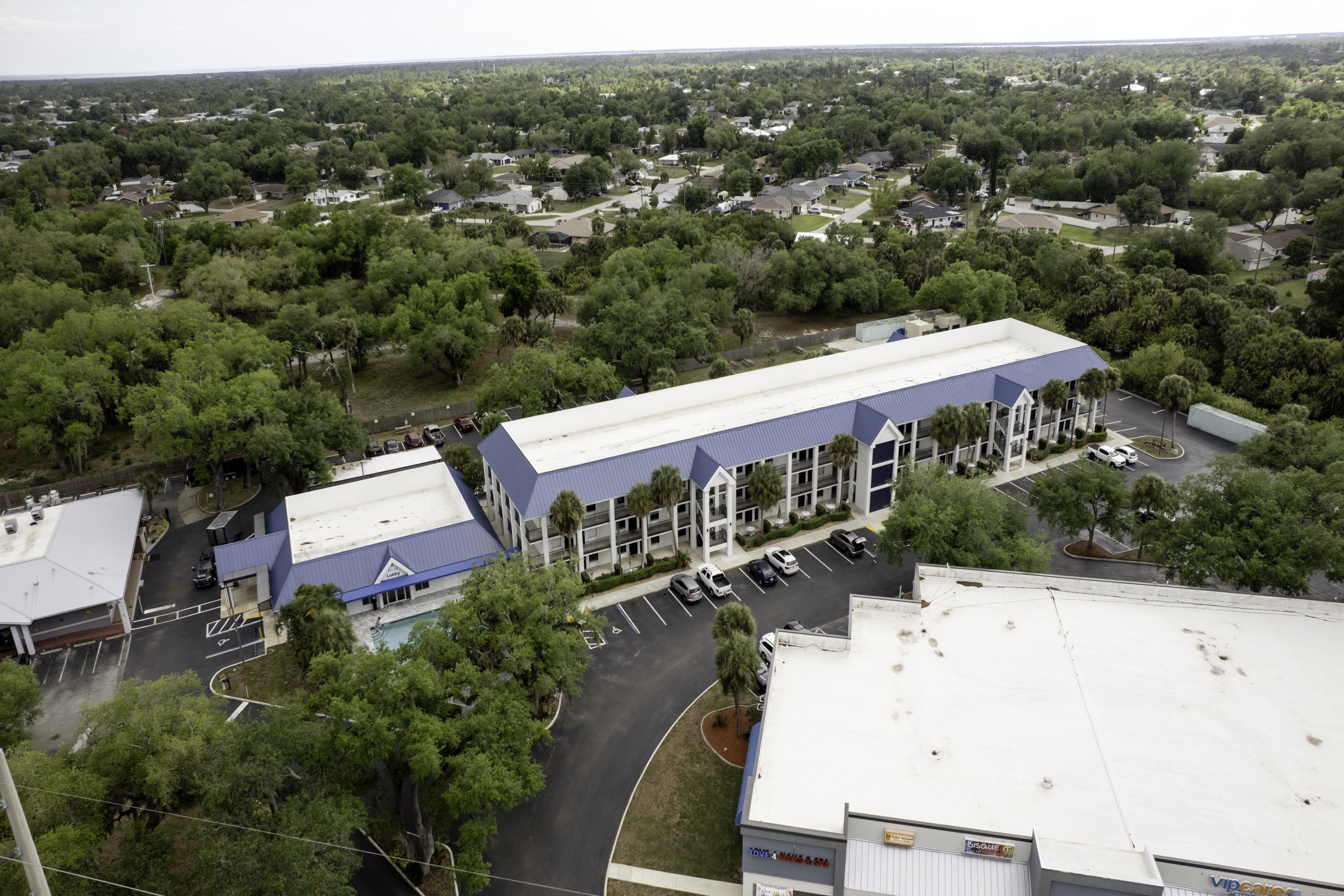 Aerial View of Days Inn by Wyndham Port Charlotte/Punta Gorda hotel in Port Charlotte, Florida