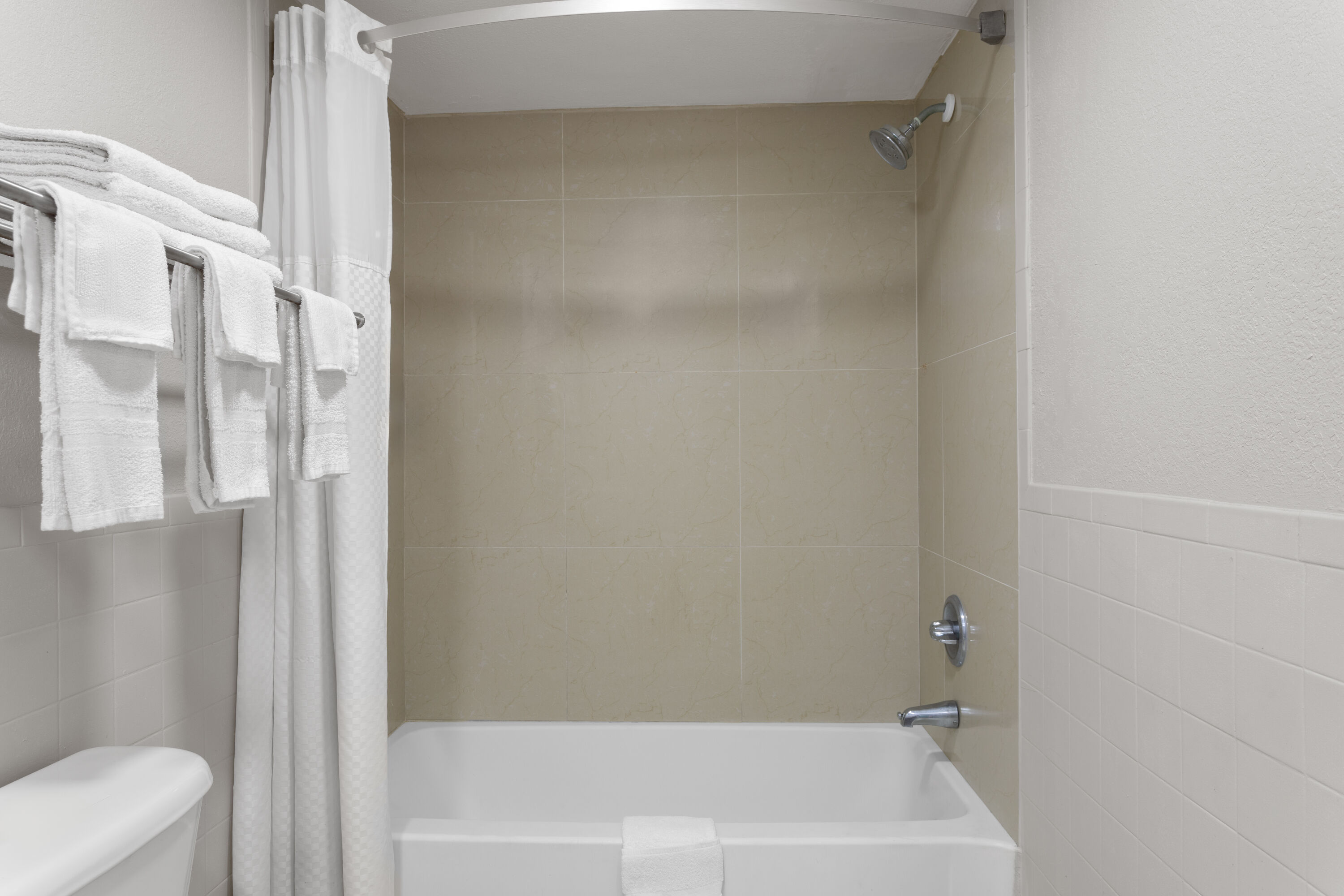 Guest room bath at the Days Inn by Wyndham St. Petersburg Central in Saint Petersburg, Florida