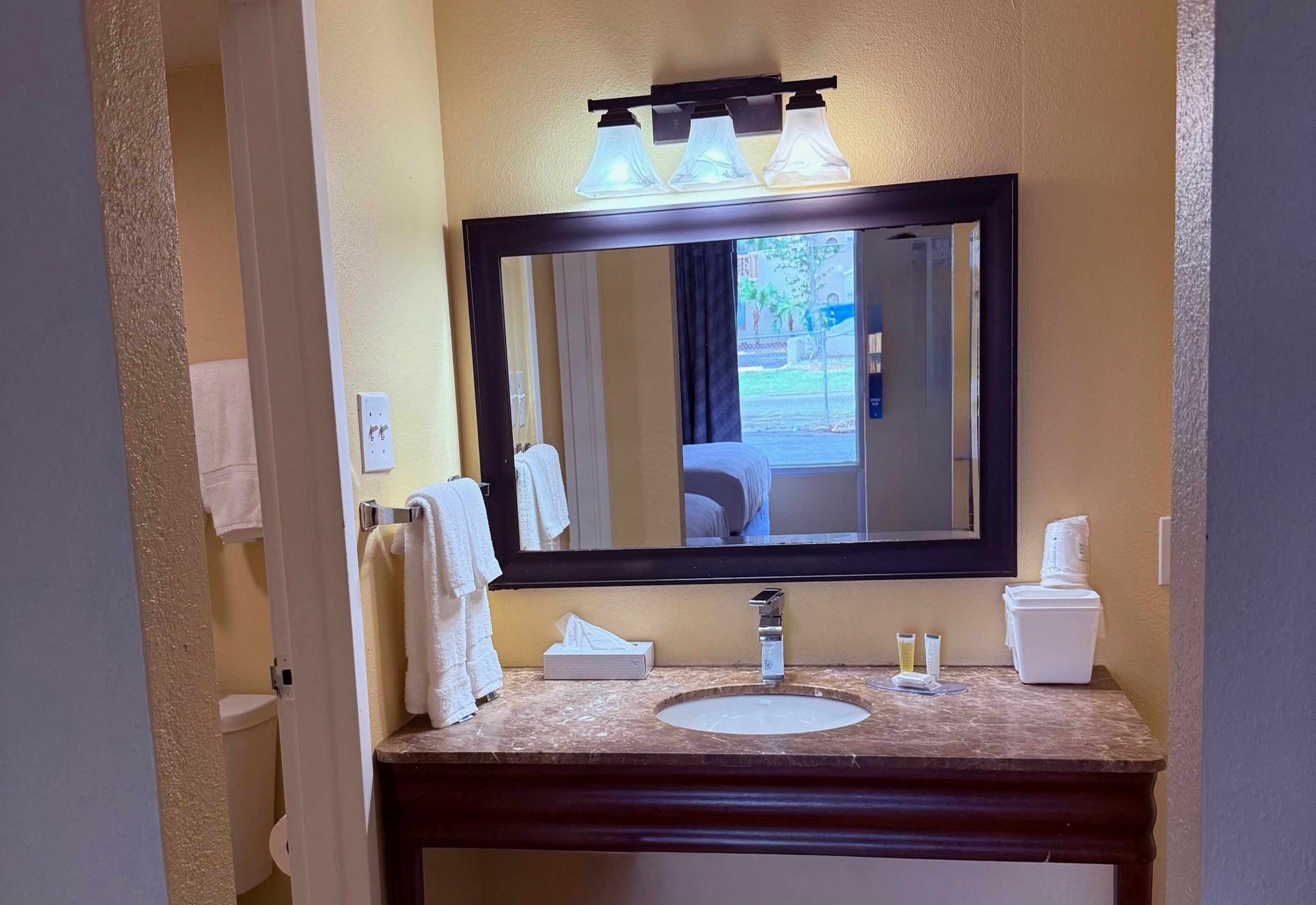 Guest room bath at the Days Inn by Wyndham St. Petersburg / Tampa Bay Area in Saint Petersburg, Florida