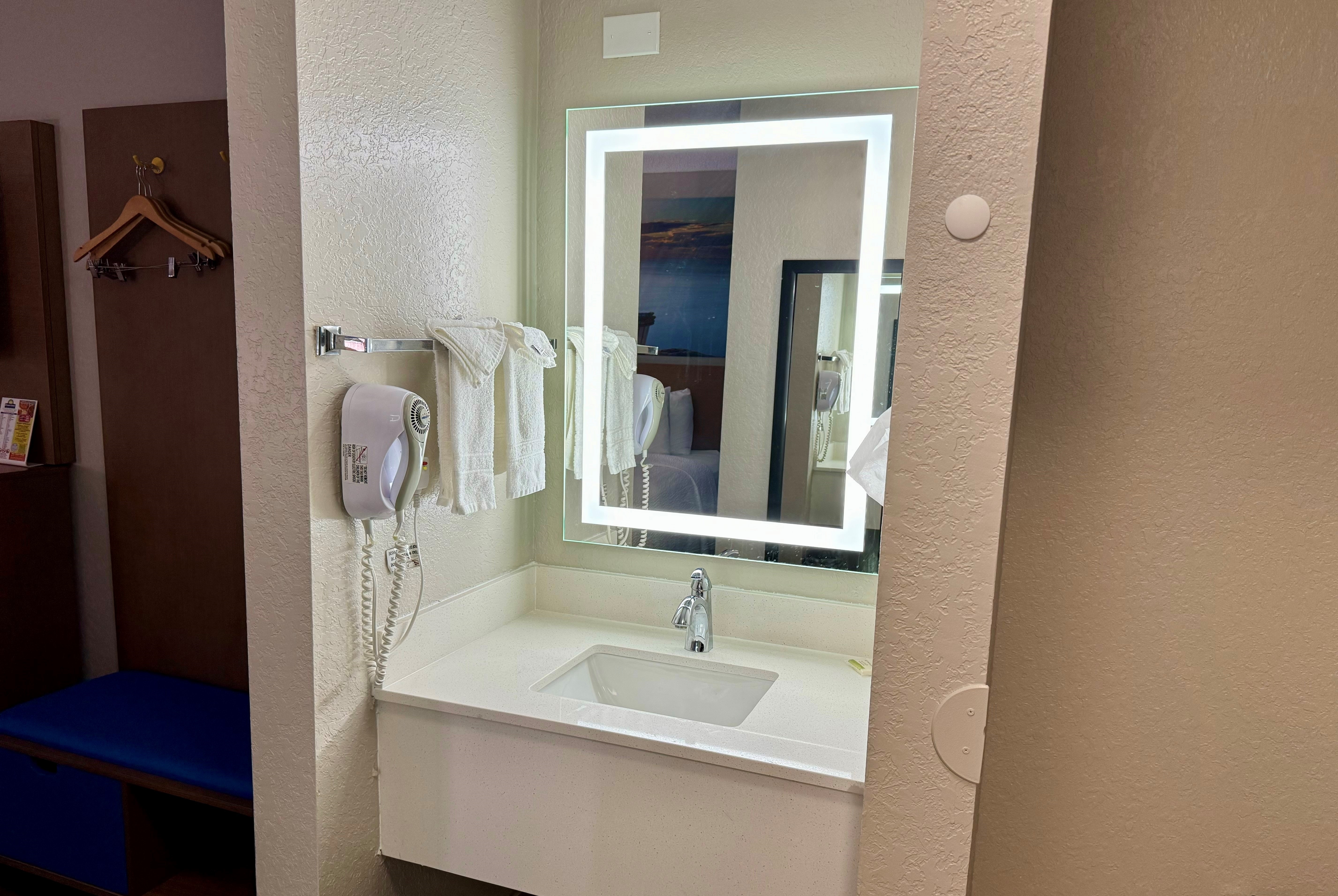 Guest room bath at the Days Inn by Wyndham Sarasota I-75 in Sarasota, Florida