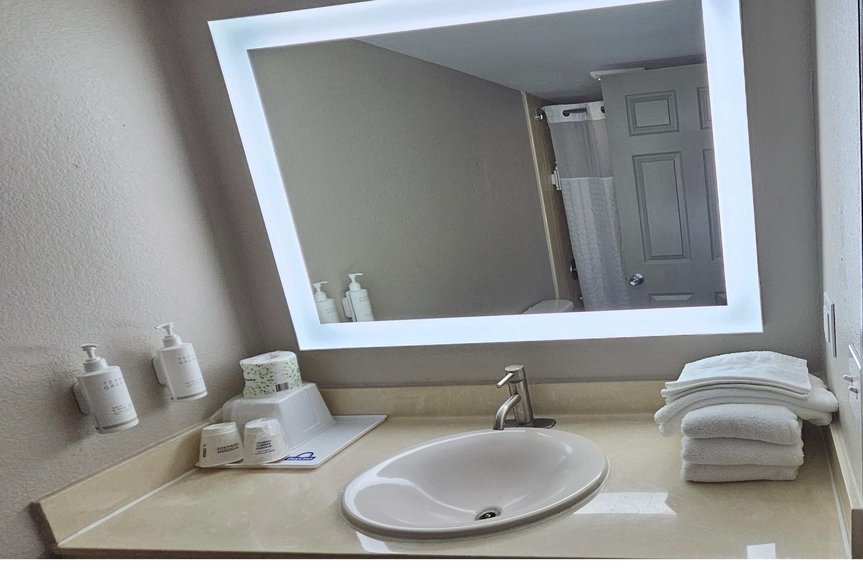 Guest room bath at the Days Inn & Suites by Wyndham Tampa/Fairground/Casino Area in Tampa, Florida