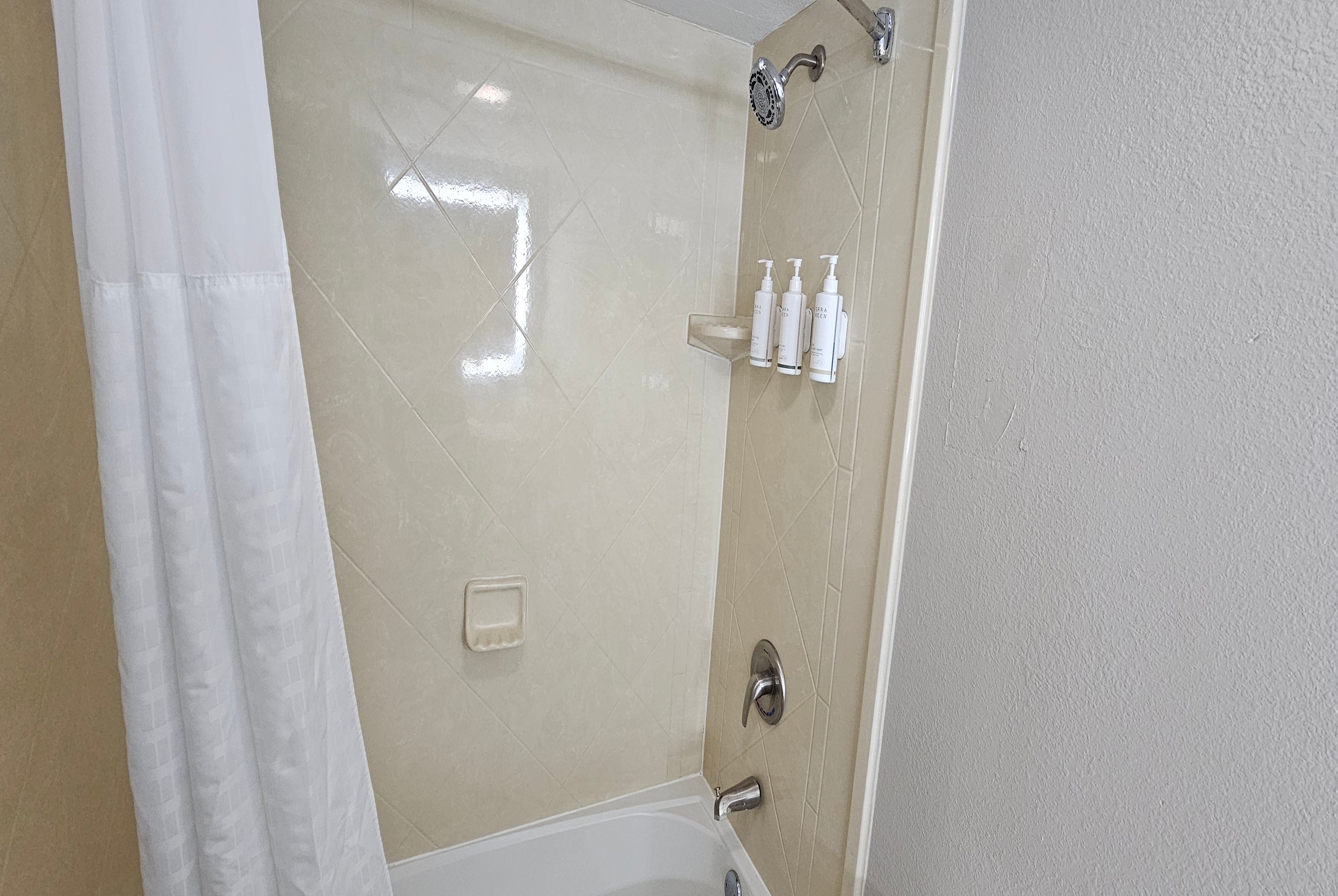 Guest room bath at the Days Inn & Suites by Wyndham Tampa/Fairground/Casino Area in Tampa, Florida