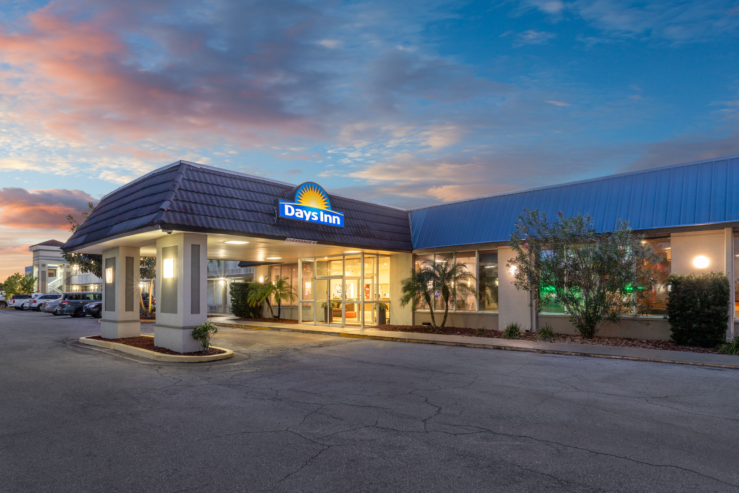 Exterior Dusk Image of Days Inn by Wyndham Titusville Kennedy Space Center hotel in Titusville, Florida