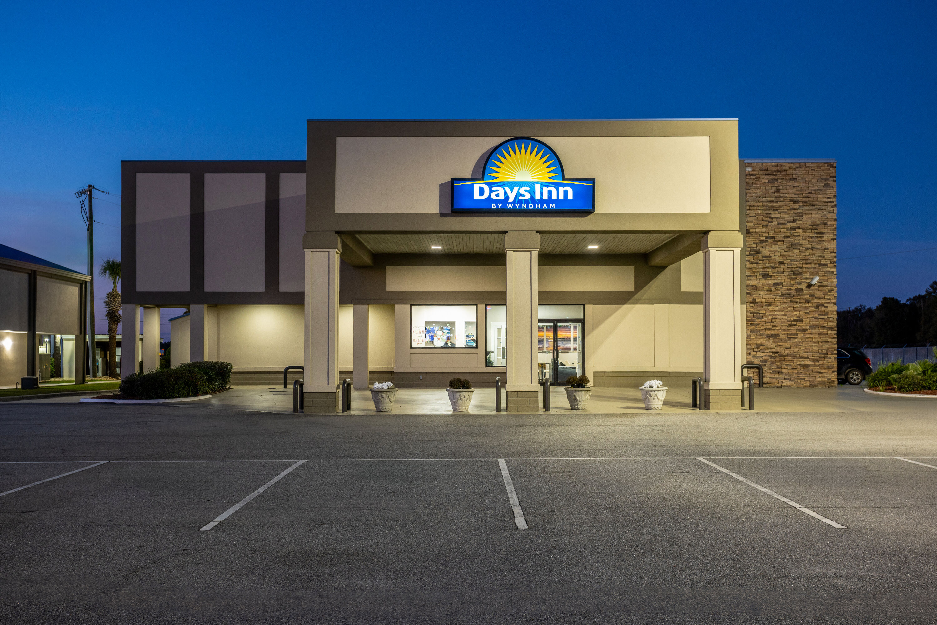 Exterior Night Image of Days Inn by Wyndham Adel I-75 hotel in Adel, Georgia