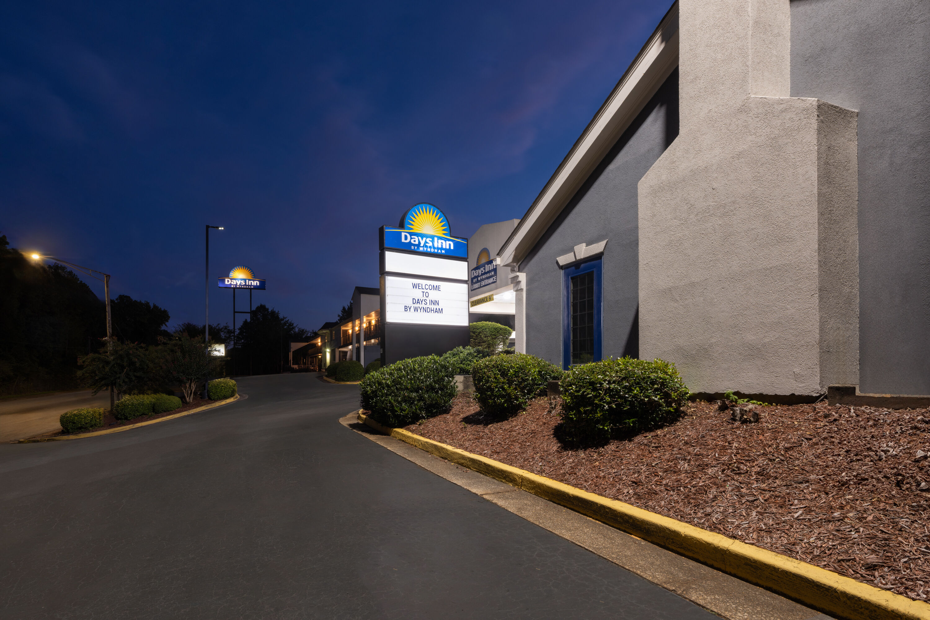 Exterior Dusk Image of Days Inn by Wyndham College Park Airport Best Road hotel in College Park, Georgia
