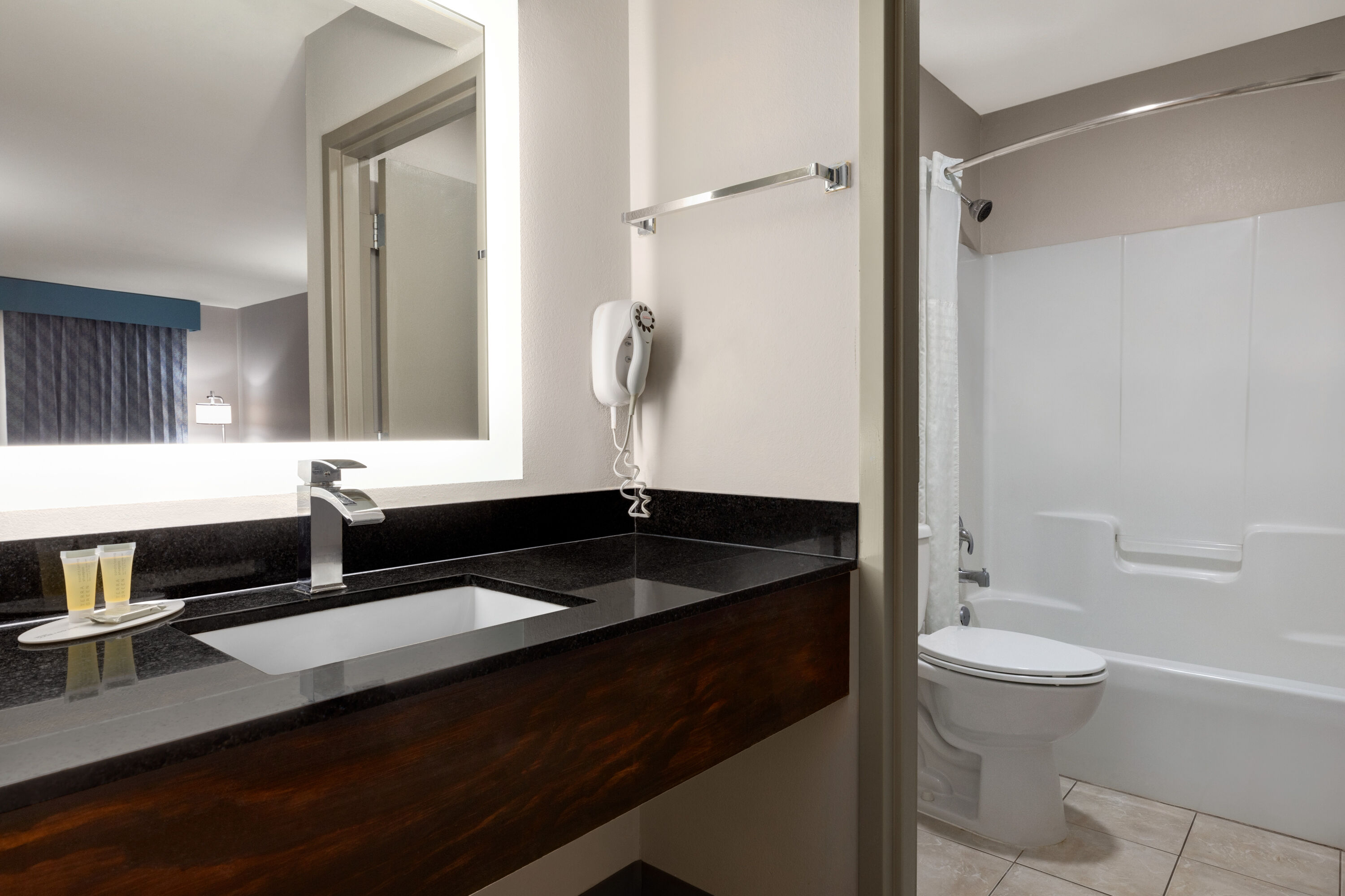 Guest room bath at the Days Inn by Wyndham Covington in Covington, Georgia