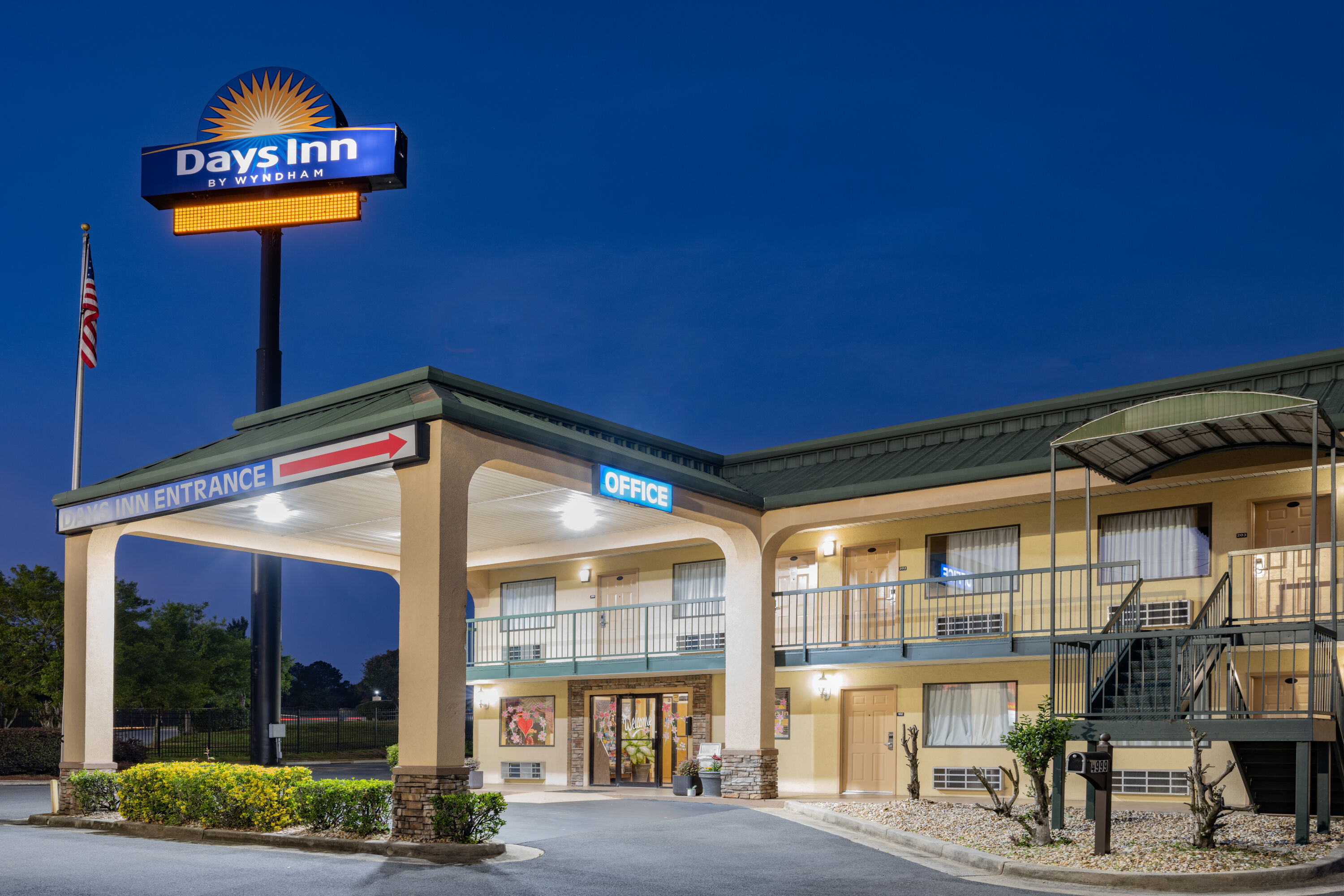 Exterior Dusk Image of Days Inn by Wyndham Macon I-475 hotel in Macon, Georgia