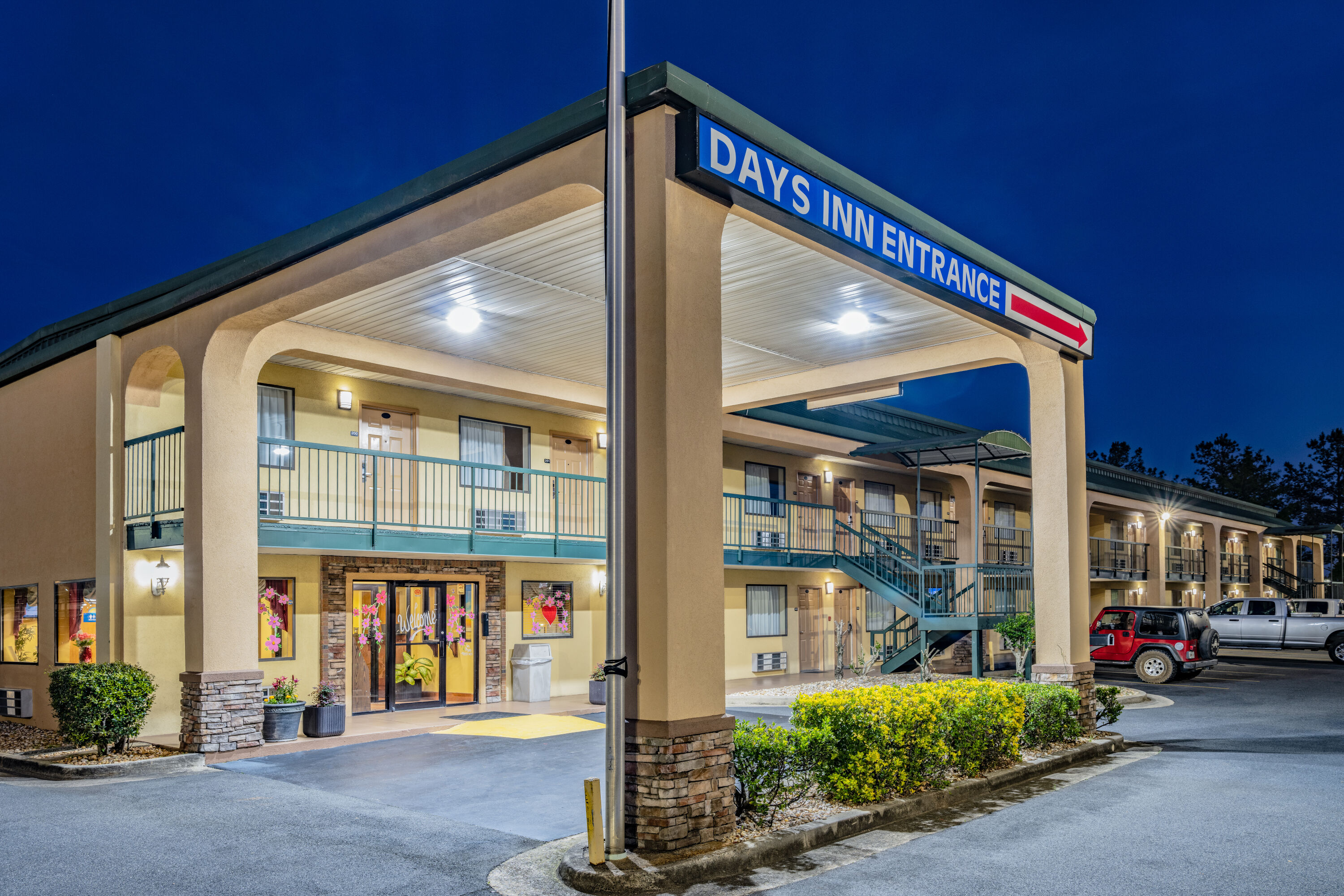 Exterior Dusk Image of Days Inn by Wyndham Macon I-475 hotel in Macon, Georgia