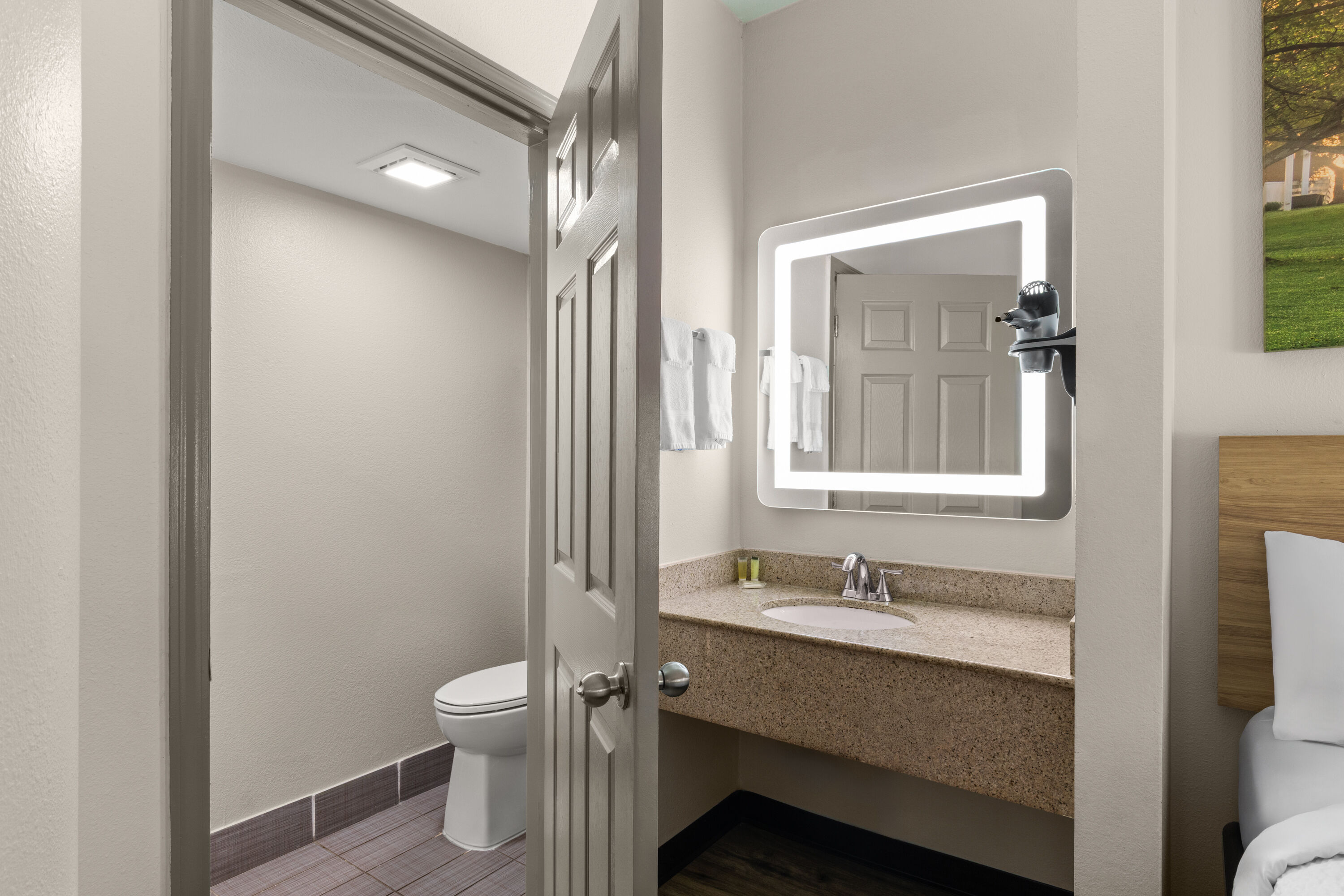 Guest room bath at the Days Inn by Wyndham McDonough in McDonough, Georgia