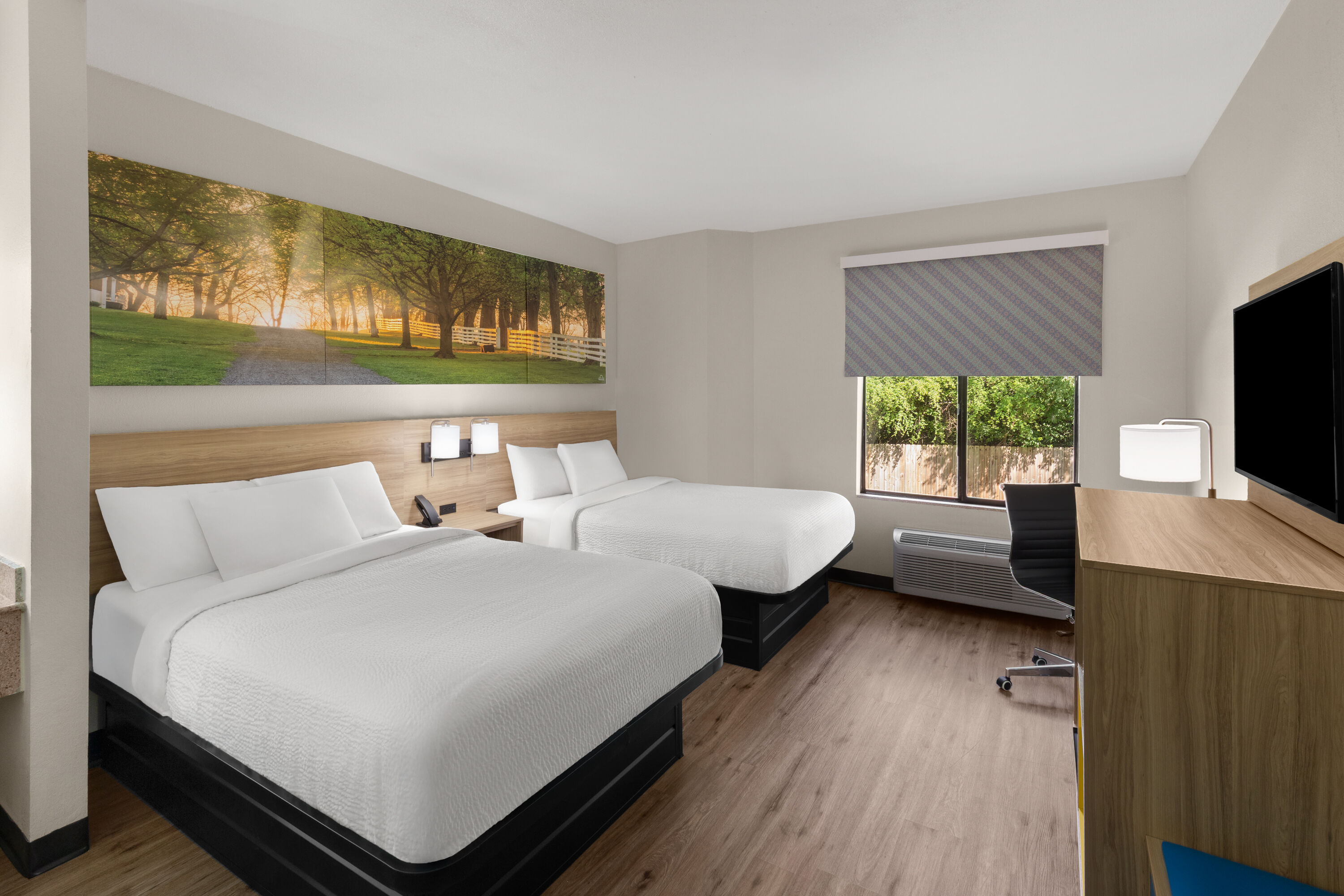 Guest room at the Days Inn by Wyndham McDonough in McDonough, Georgia