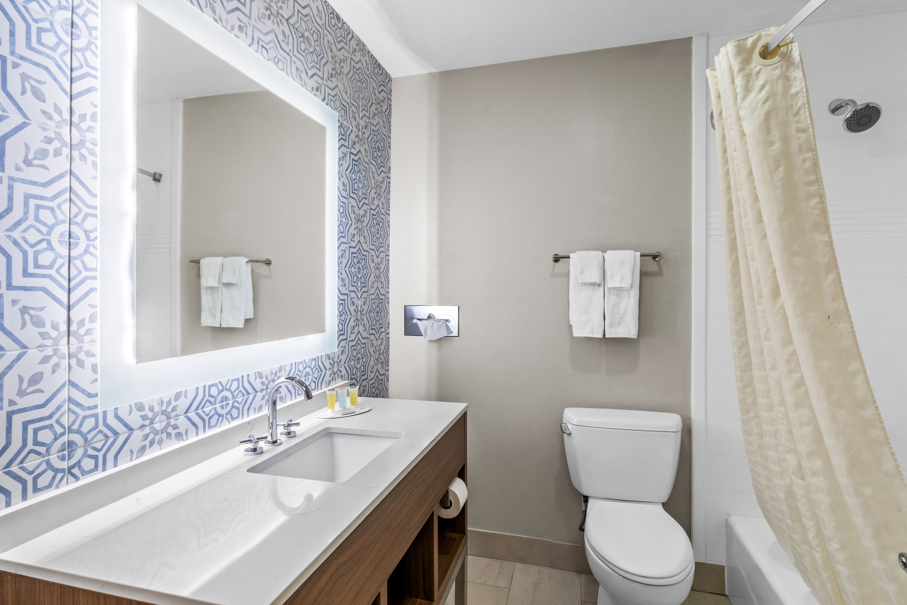 Guest room bath at the Days Inn & Suites by Wyndham Peachtree Corners/Norcross in Norcross, Georgia