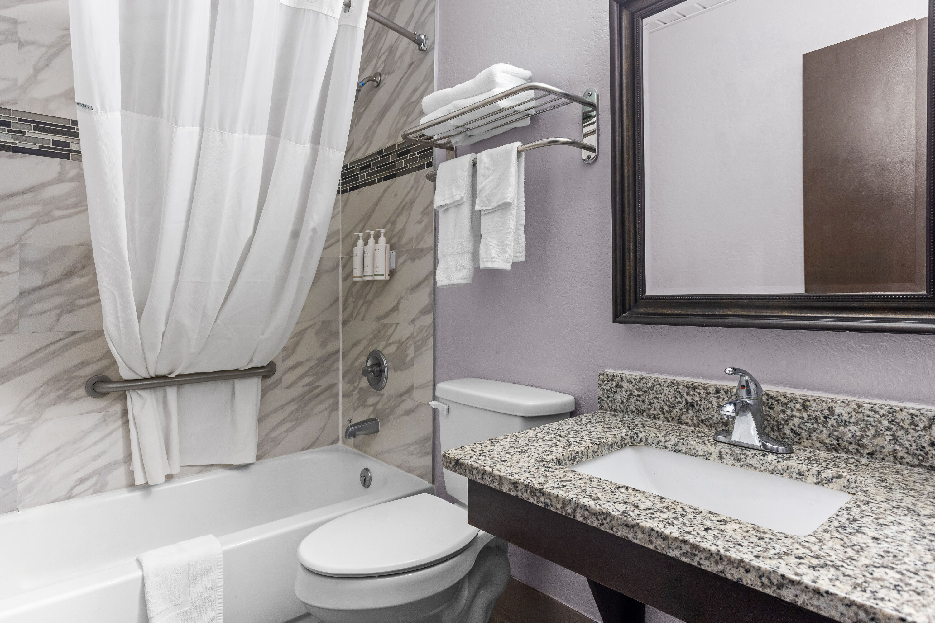 Guest room bath at the Days Inn by Wyndham Savannah Gateway I-95 in Savannah, Georgia