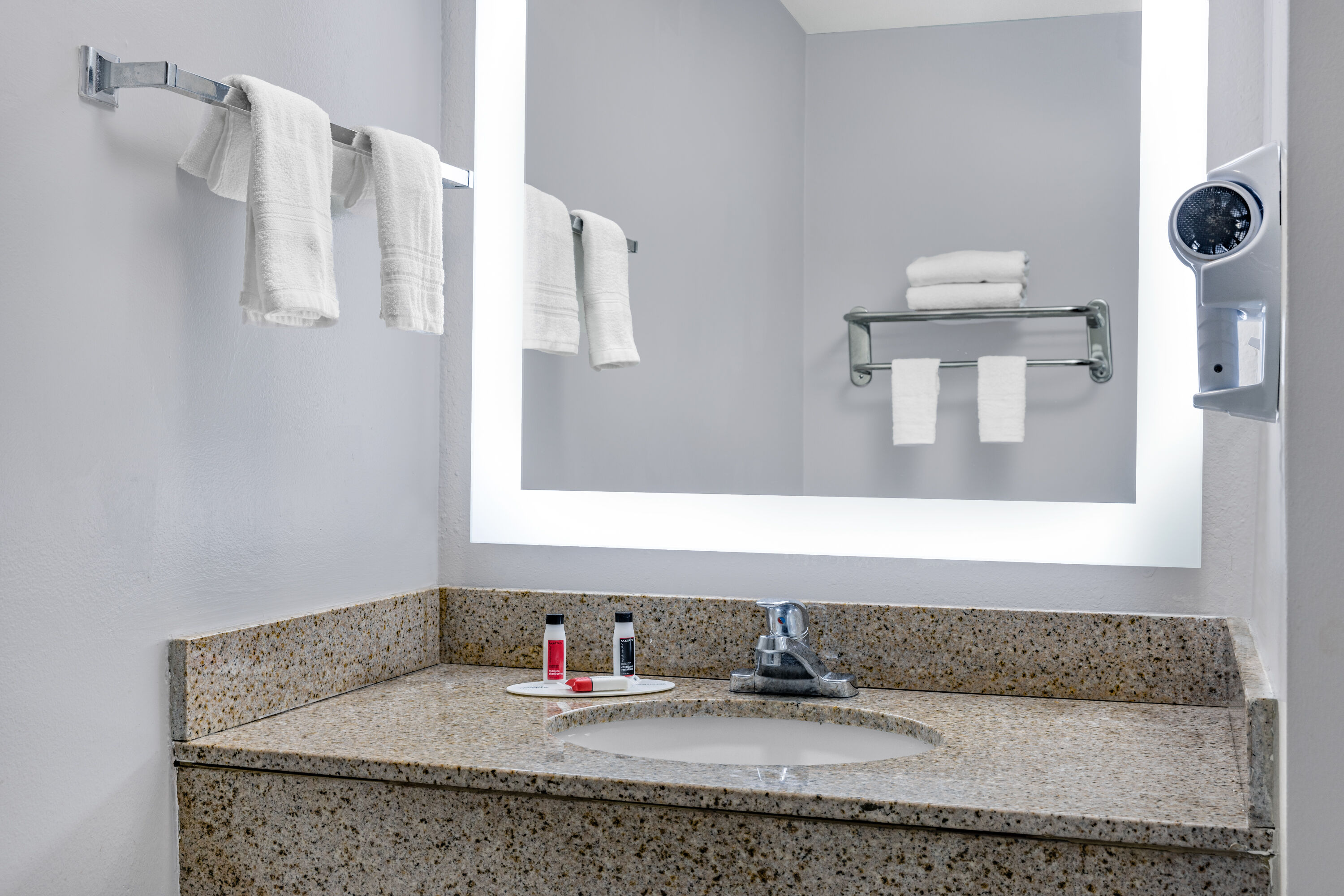 Guest room bath at the Days Inn & Suites by Wyndham Savannah Midtown in Savannah, Georgia