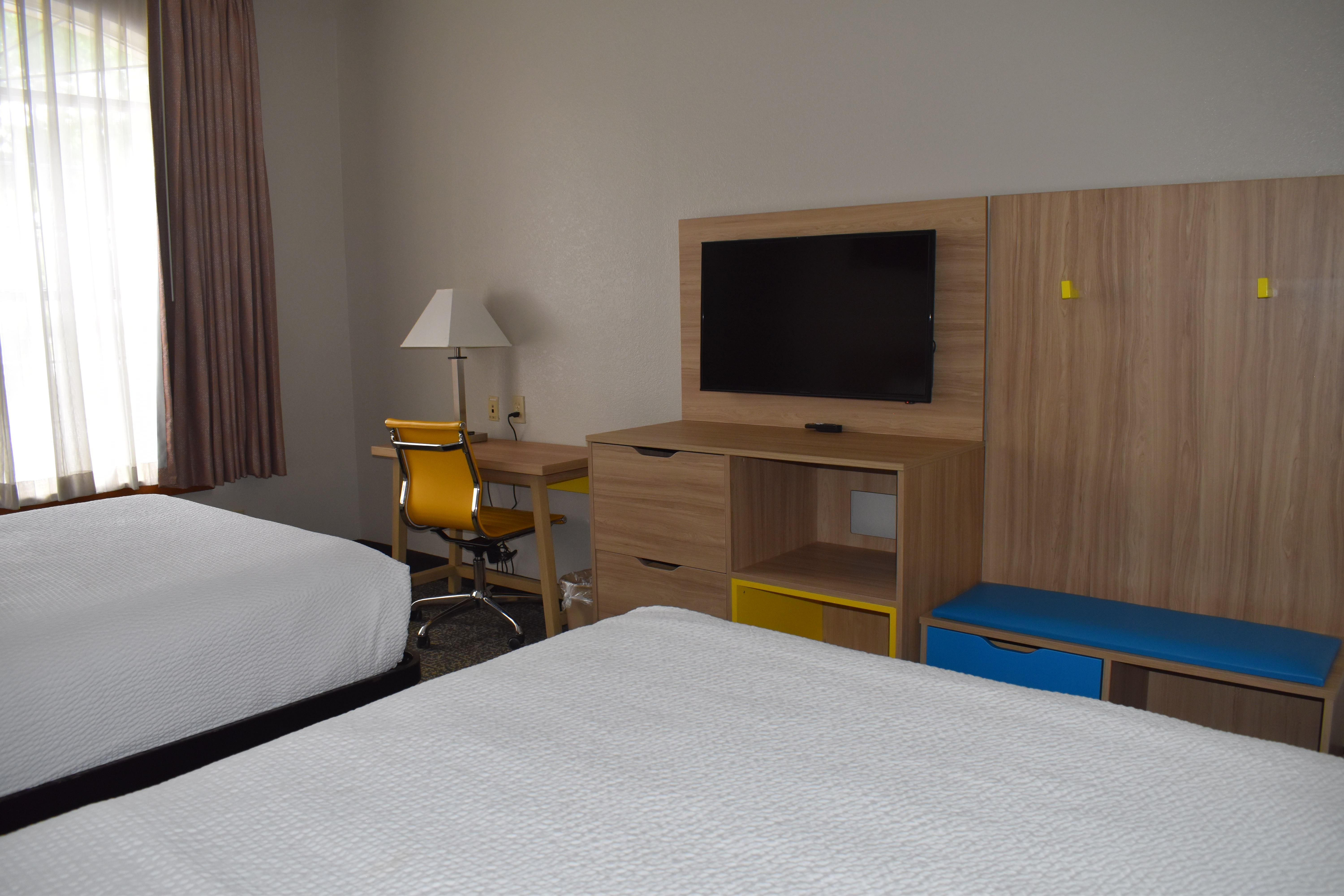 Guest room at the Days Inn & Suites by Wyndham Tucker/Northlake in Tucker, Georgia