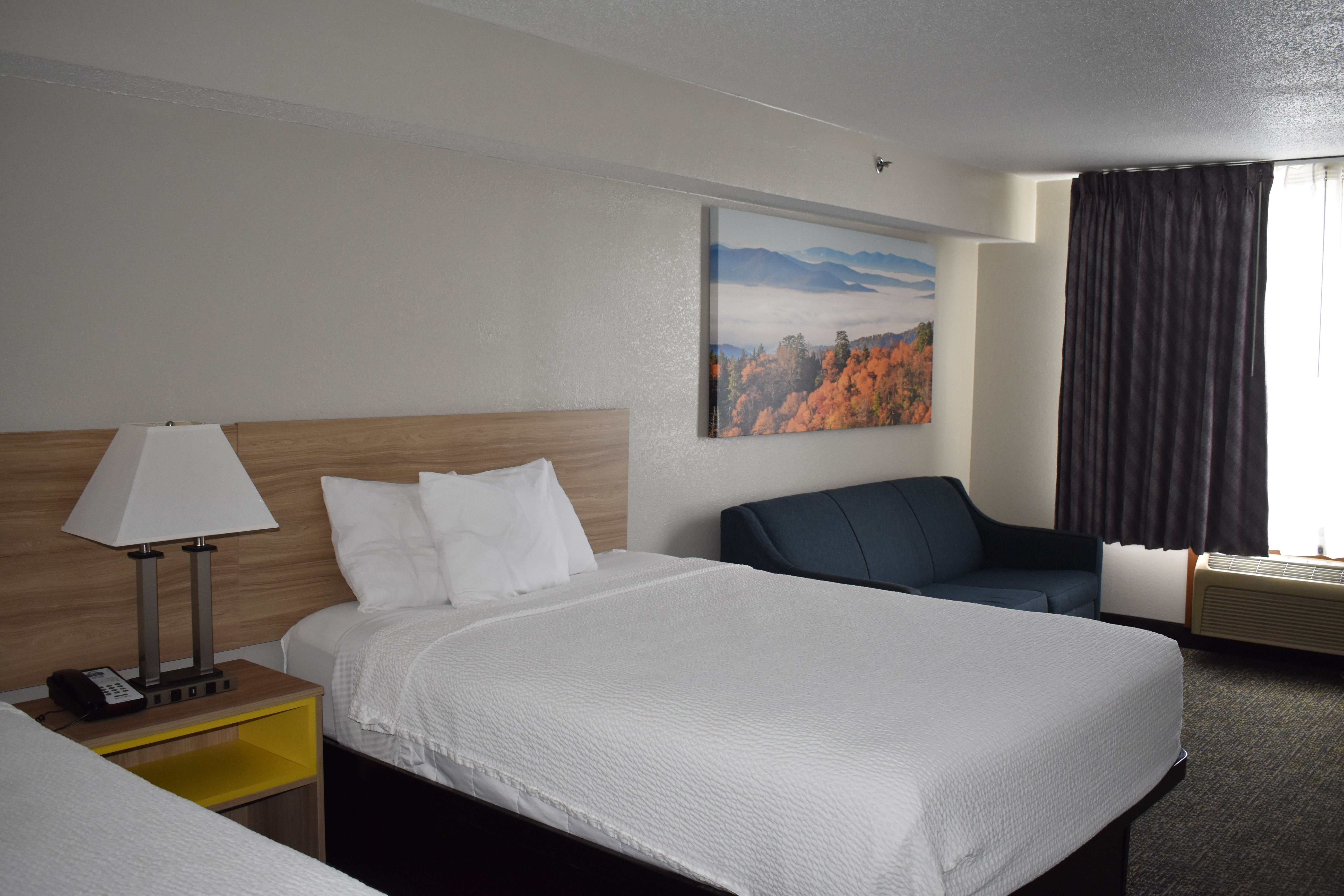 Guest room at the Days Inn & Suites by Wyndham Tucker/Northlake in Tucker, Georgia