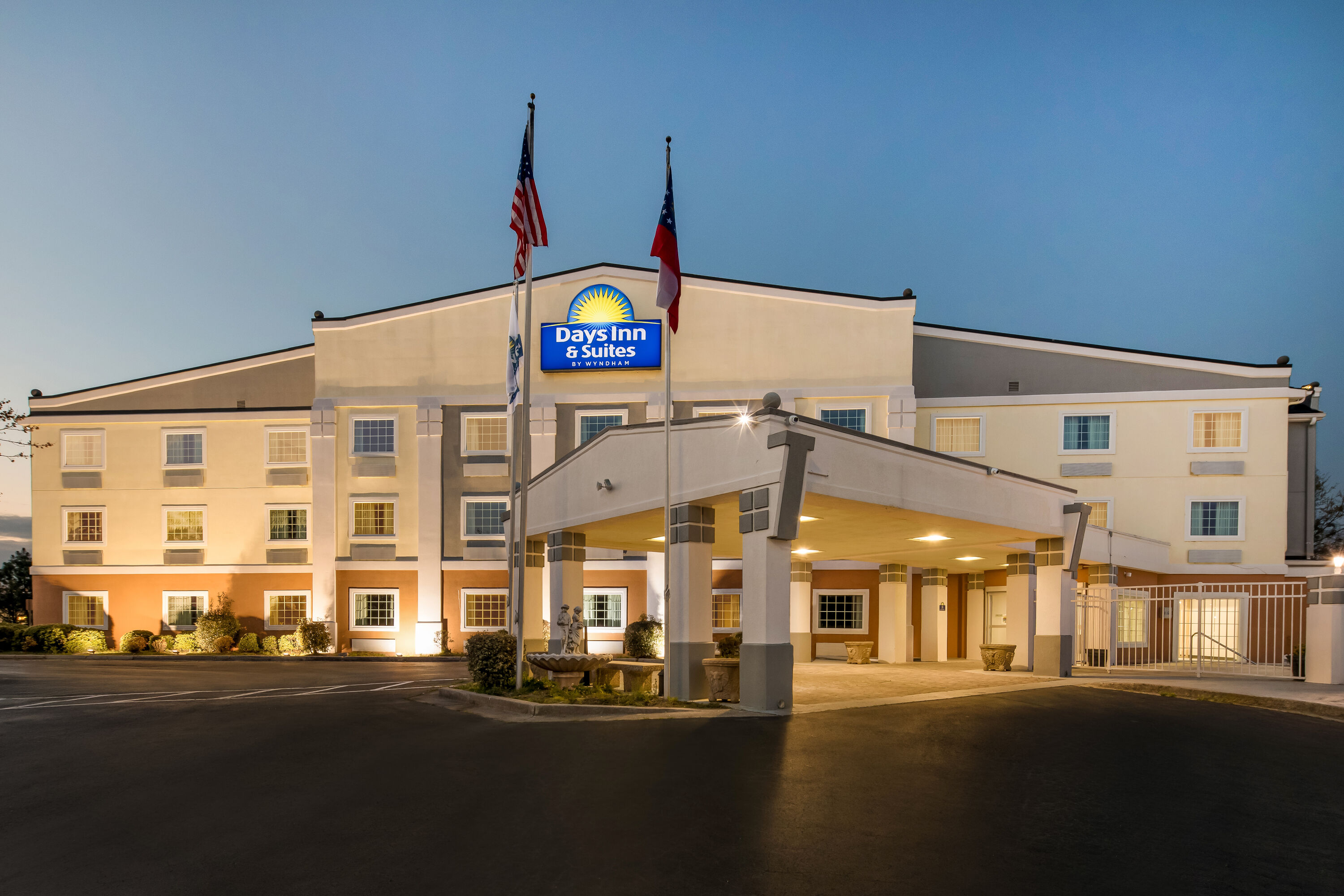 Exterior Night Image of Days Inn & Suites by Wyndham Union City hotel in Union City, Georgia
