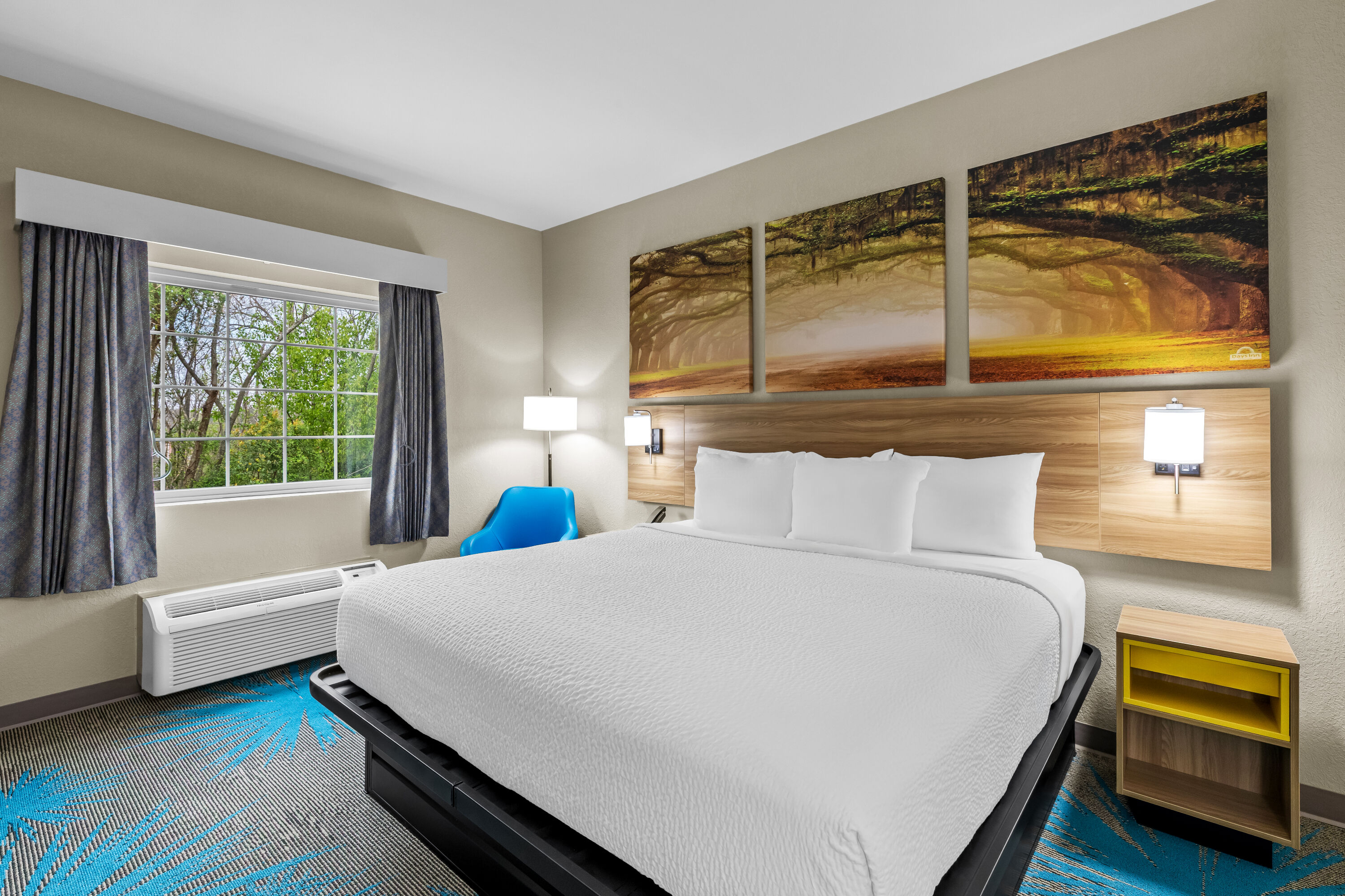 King bed guest room at the Days Inn & Suites by Wyndham Union City in Union City, Georgia