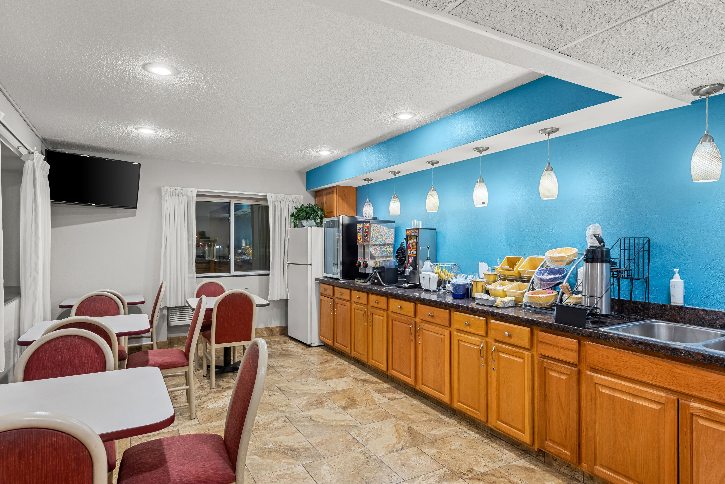 Days Inn by Wyndham Ames restaurant breakfast area with seating in Ames, Iowa