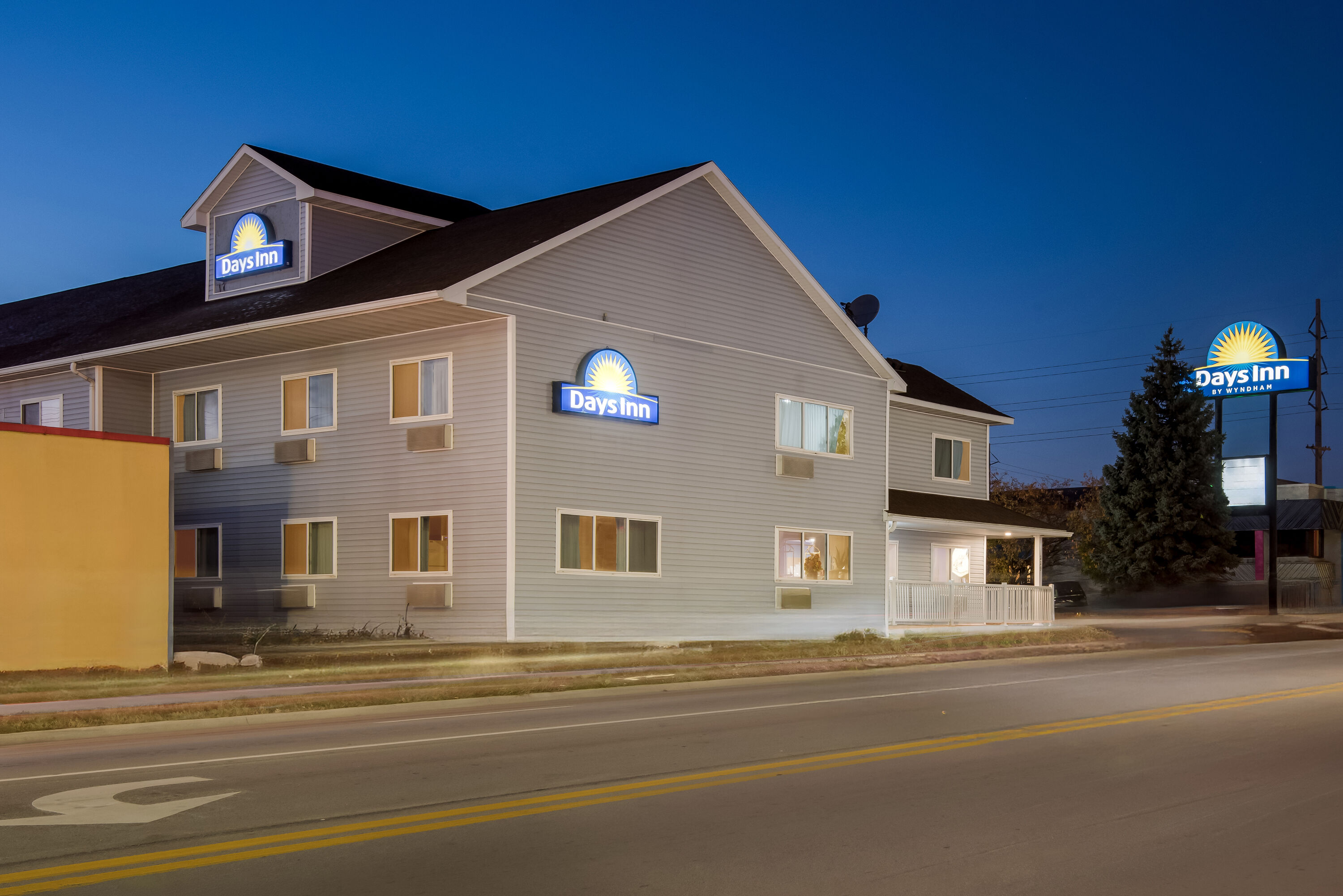 Exterior Night Image of Days Inn by Wyndham Ames hotel in Ames, Iowa
