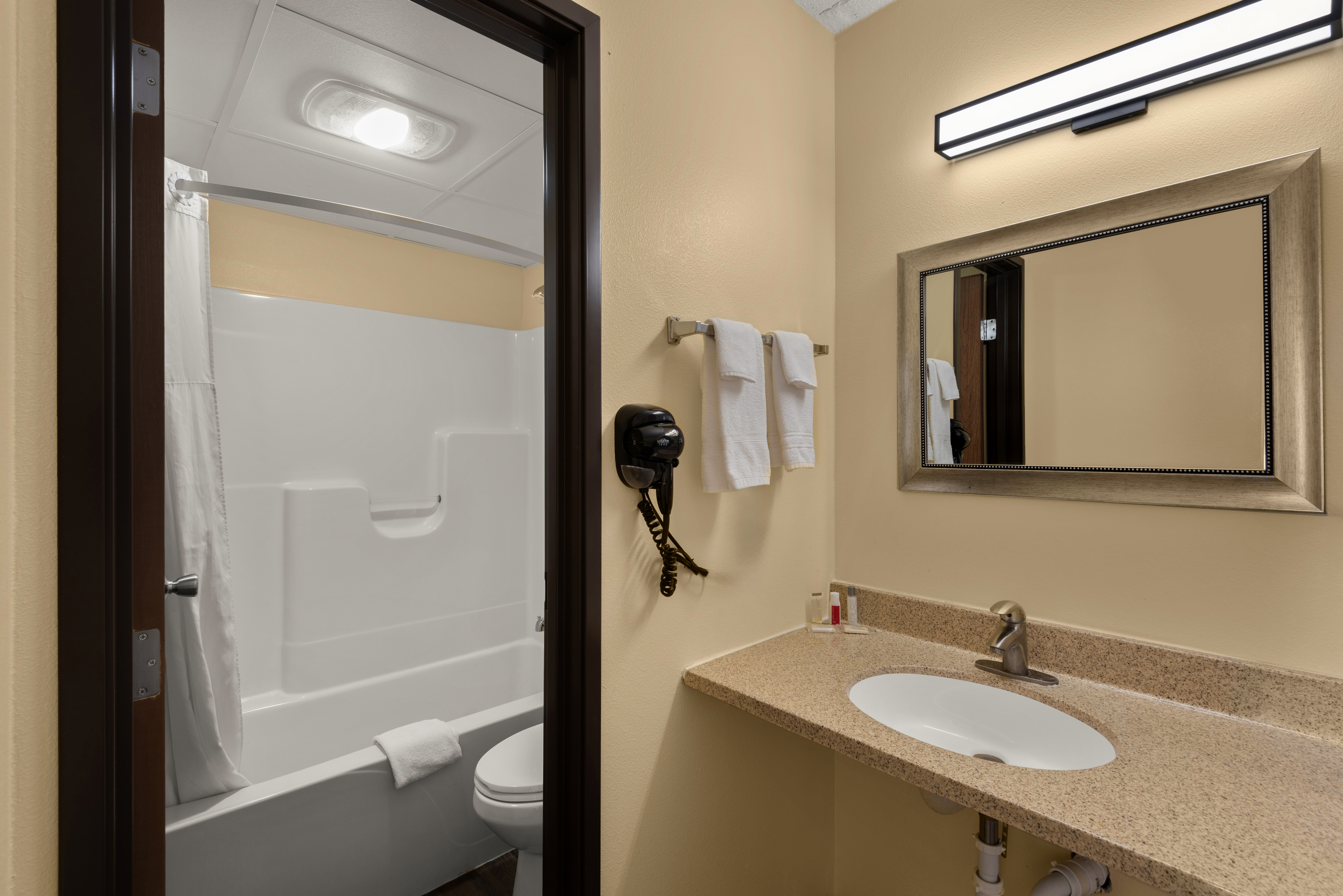 Guest room bath at the Days Inn by Wyndham Newton in Newton, Iowa