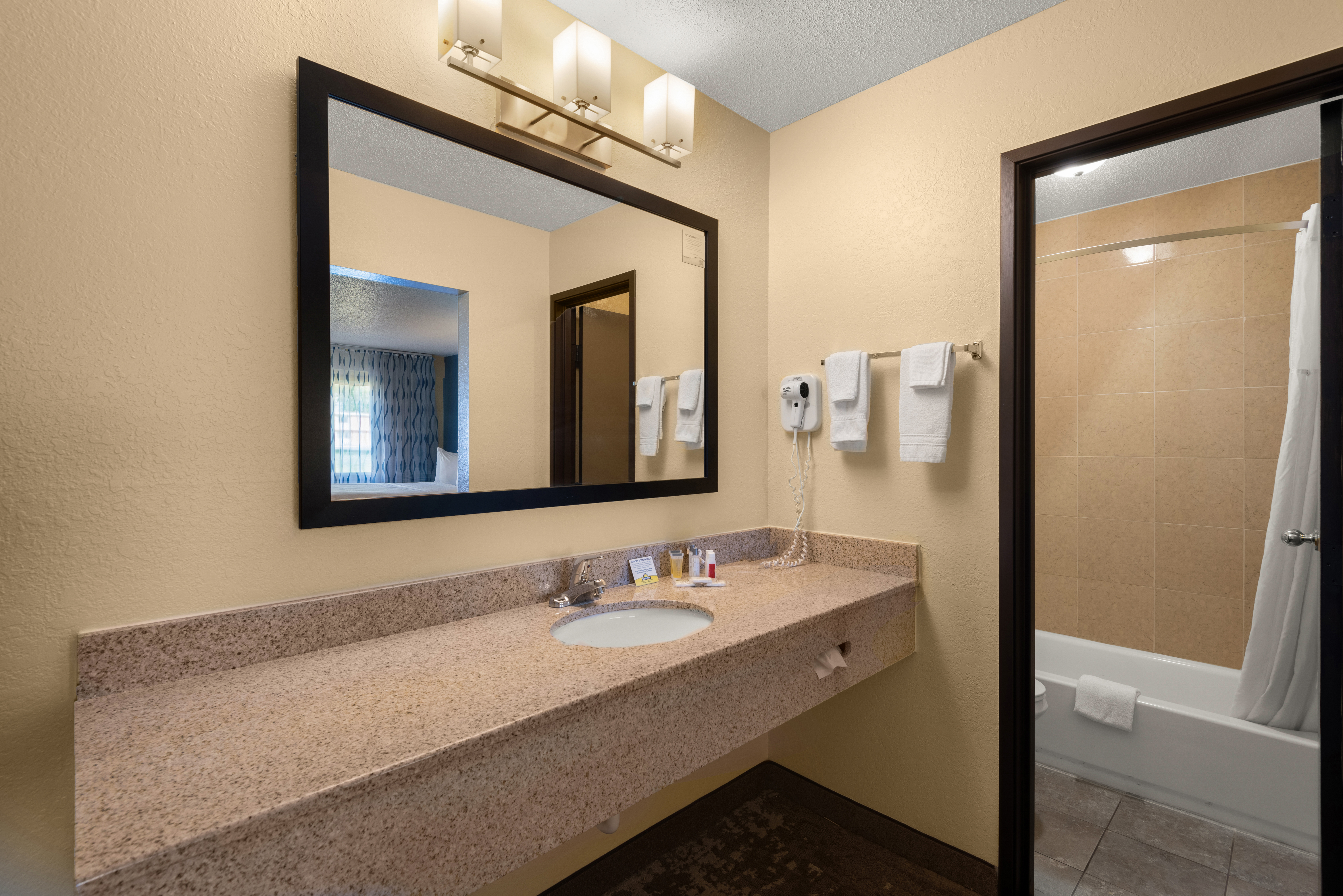 Guest room bath at the Days Inn by Wyndham Newton in Newton, Iowa