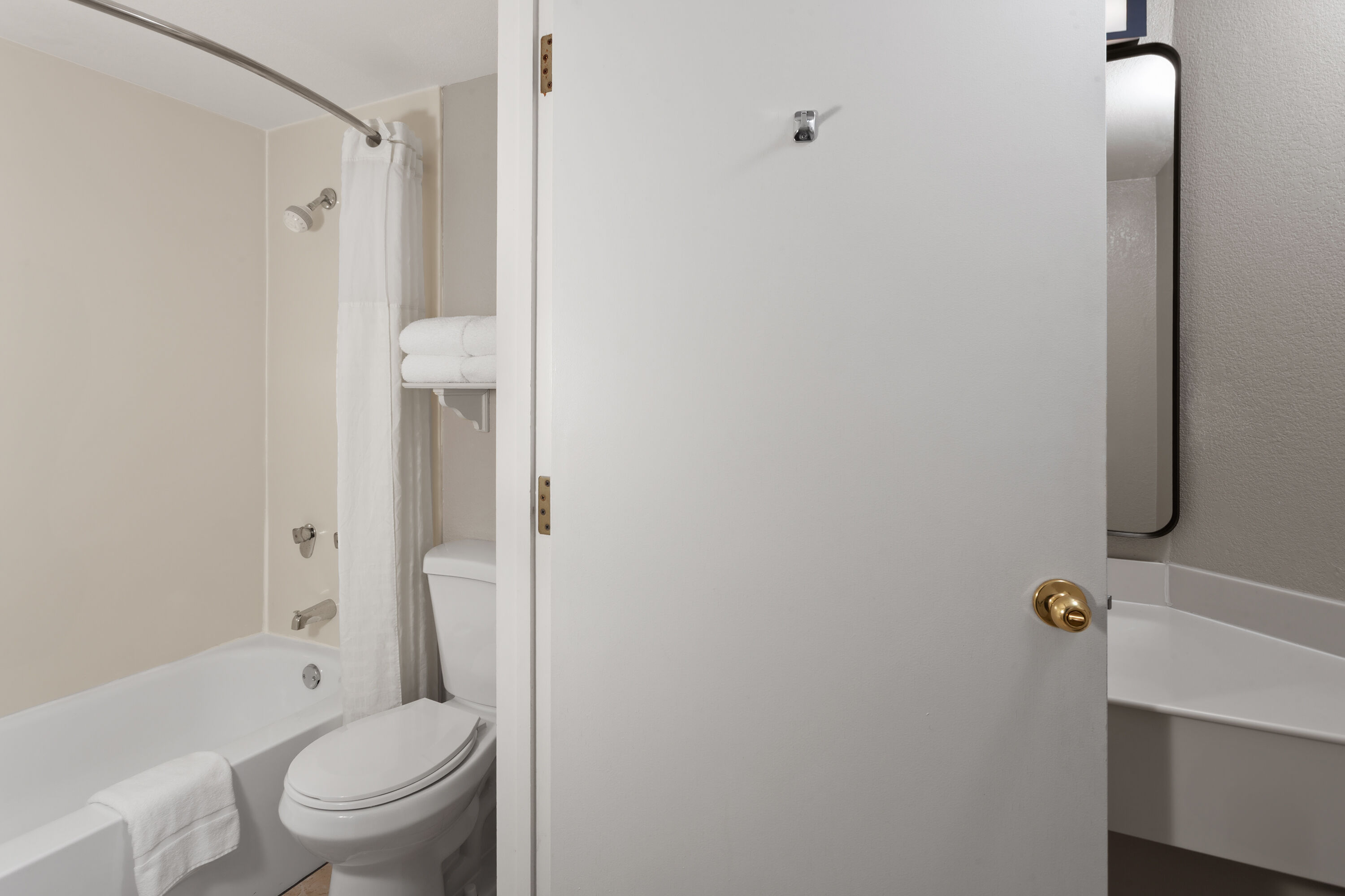 Guest room bath at the Days Inn & Suites by Wyndham Arlington Heights in Arlington Heights, Illinois