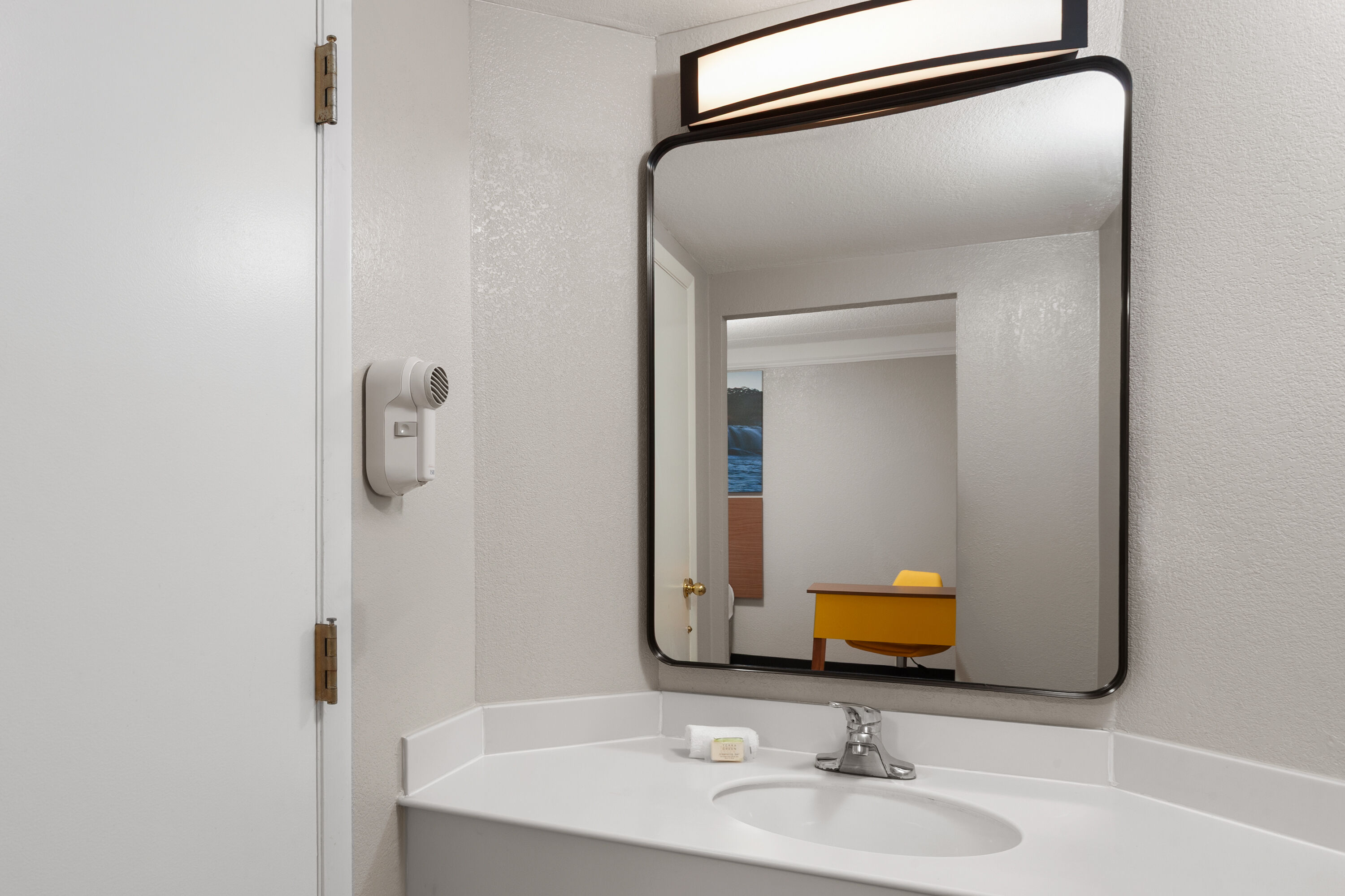Guest room bath at the Days Inn & Suites by Wyndham Arlington Heights in Arlington Heights, Illinois