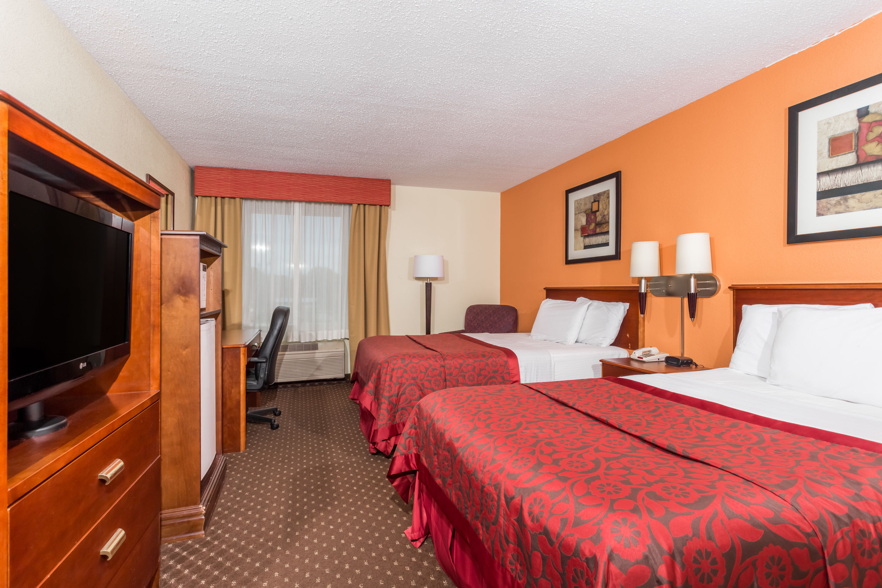 Guest room at the Days Inn & Suites by Wyndham Bloomington/Normal IL in Bloomington, Illinois