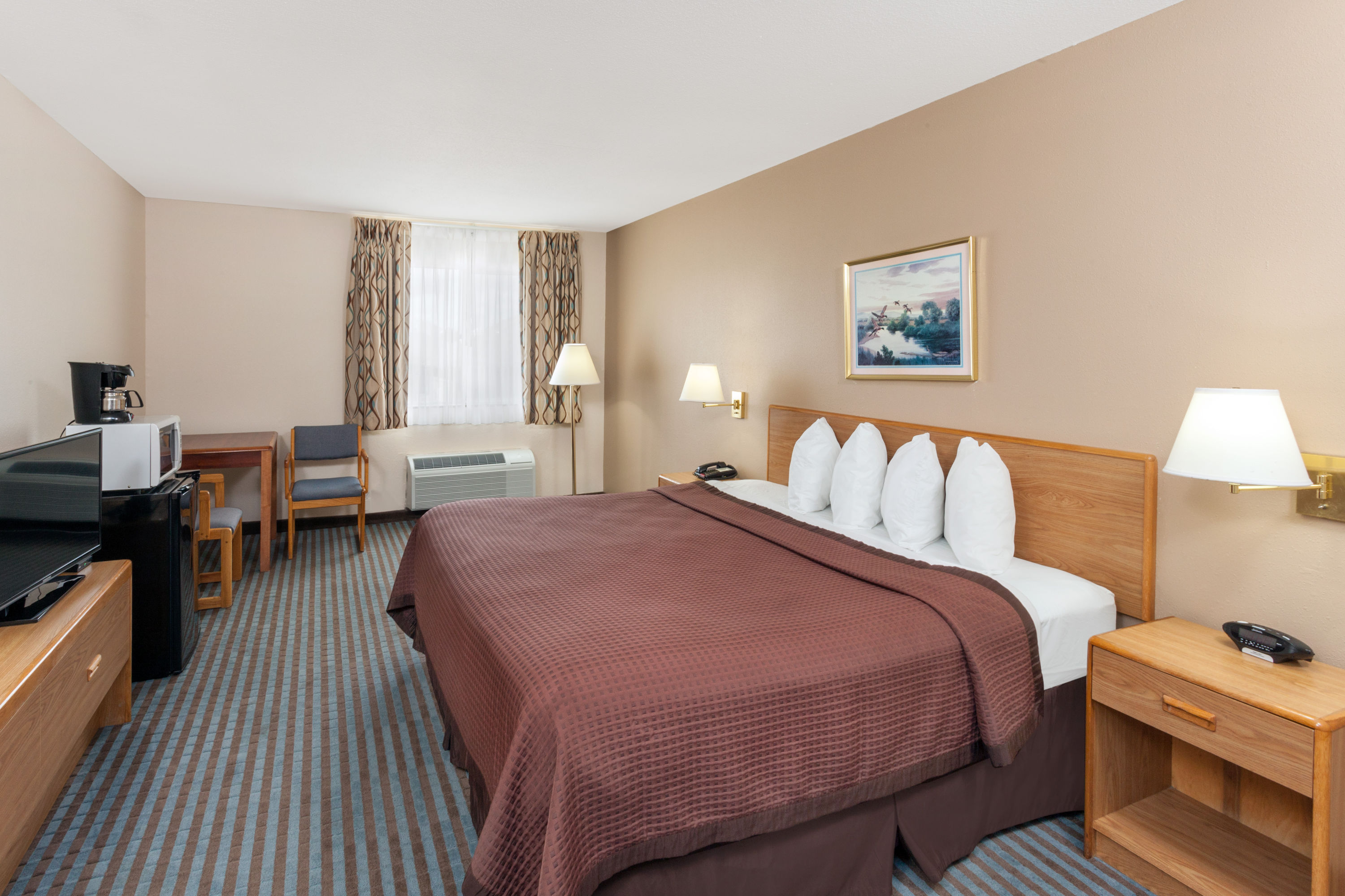 Guest room at the Days Inn by Wyndham Charleston in Charleston, Illinois