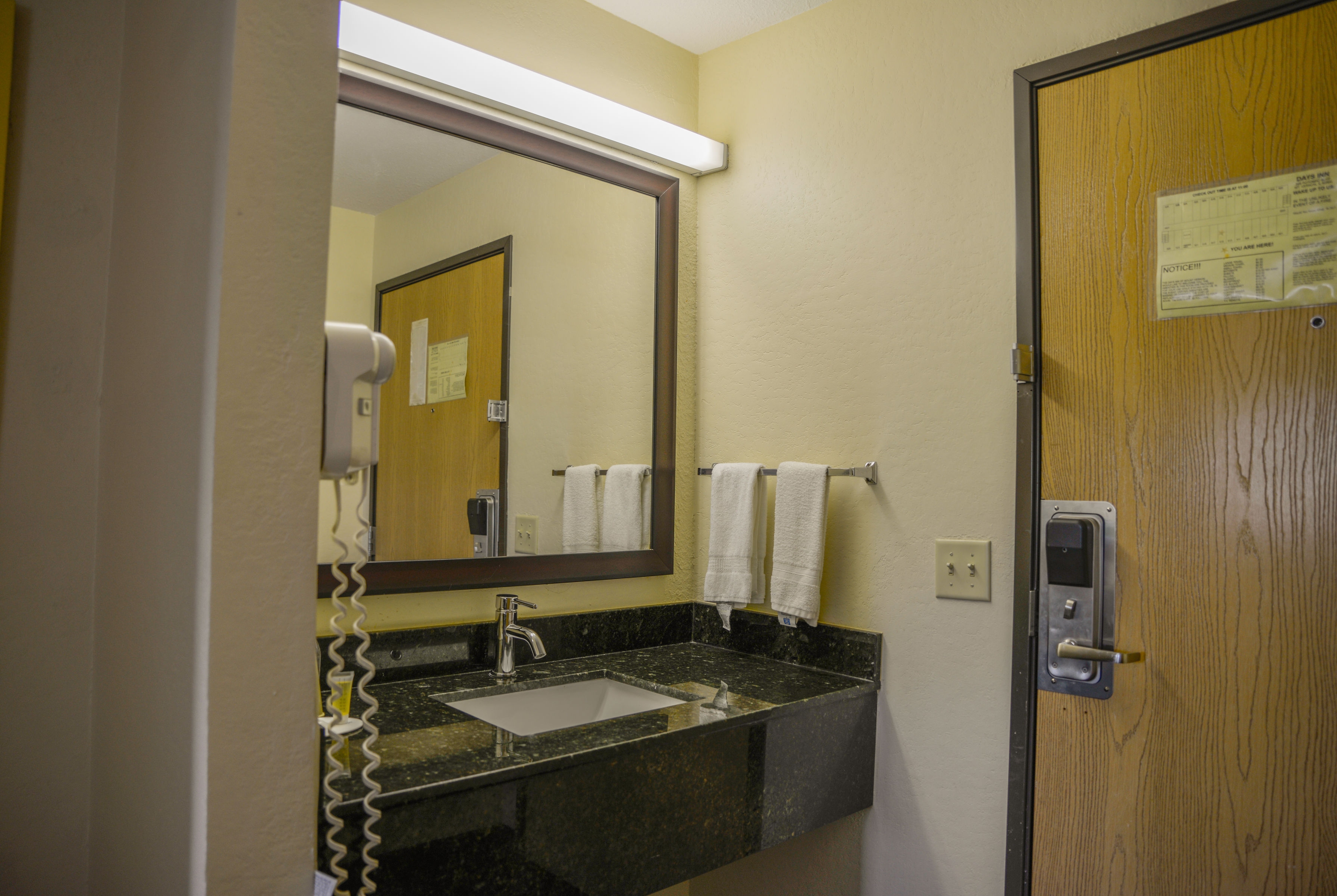 Guest room bath at the Days Inn by Wyndham Mount Vernon in Mount Vernon, Illinois