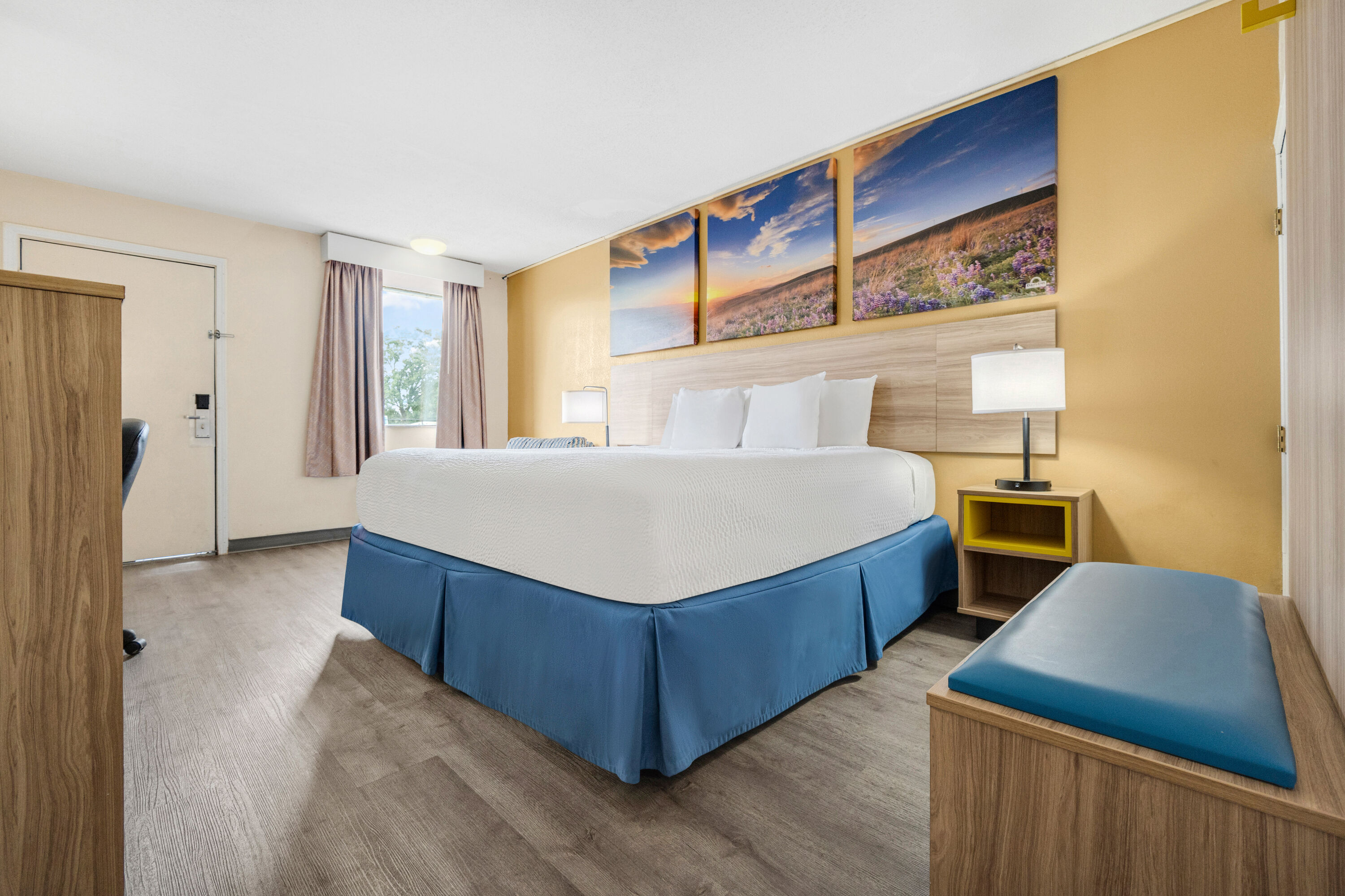 King bed guest room at the Days Inn by Wyndham Fort Wayne in Fort Wayne, Indiana