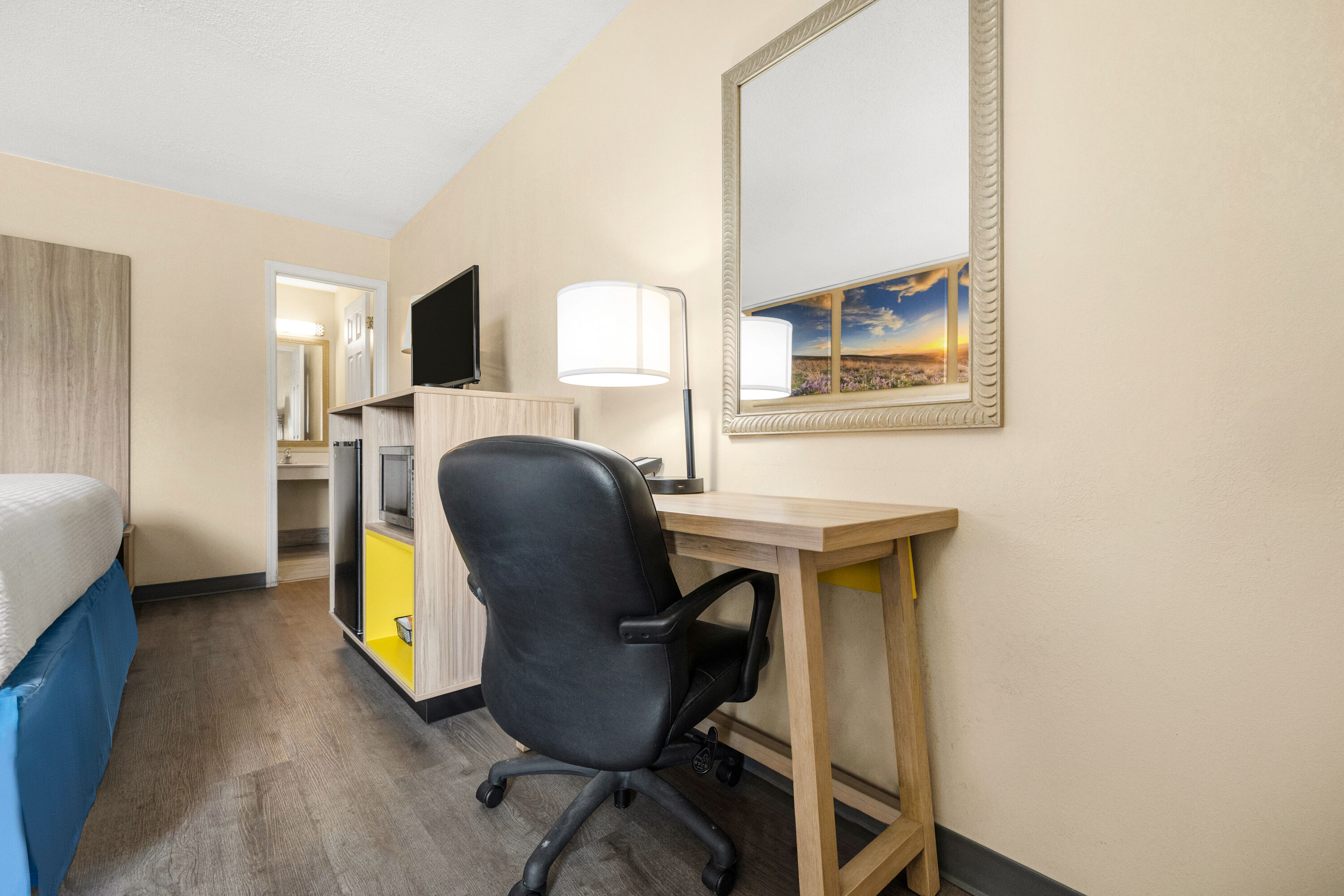 King bed guest room at the Days Inn by Wyndham Fort Wayne in Fort Wayne, Indiana