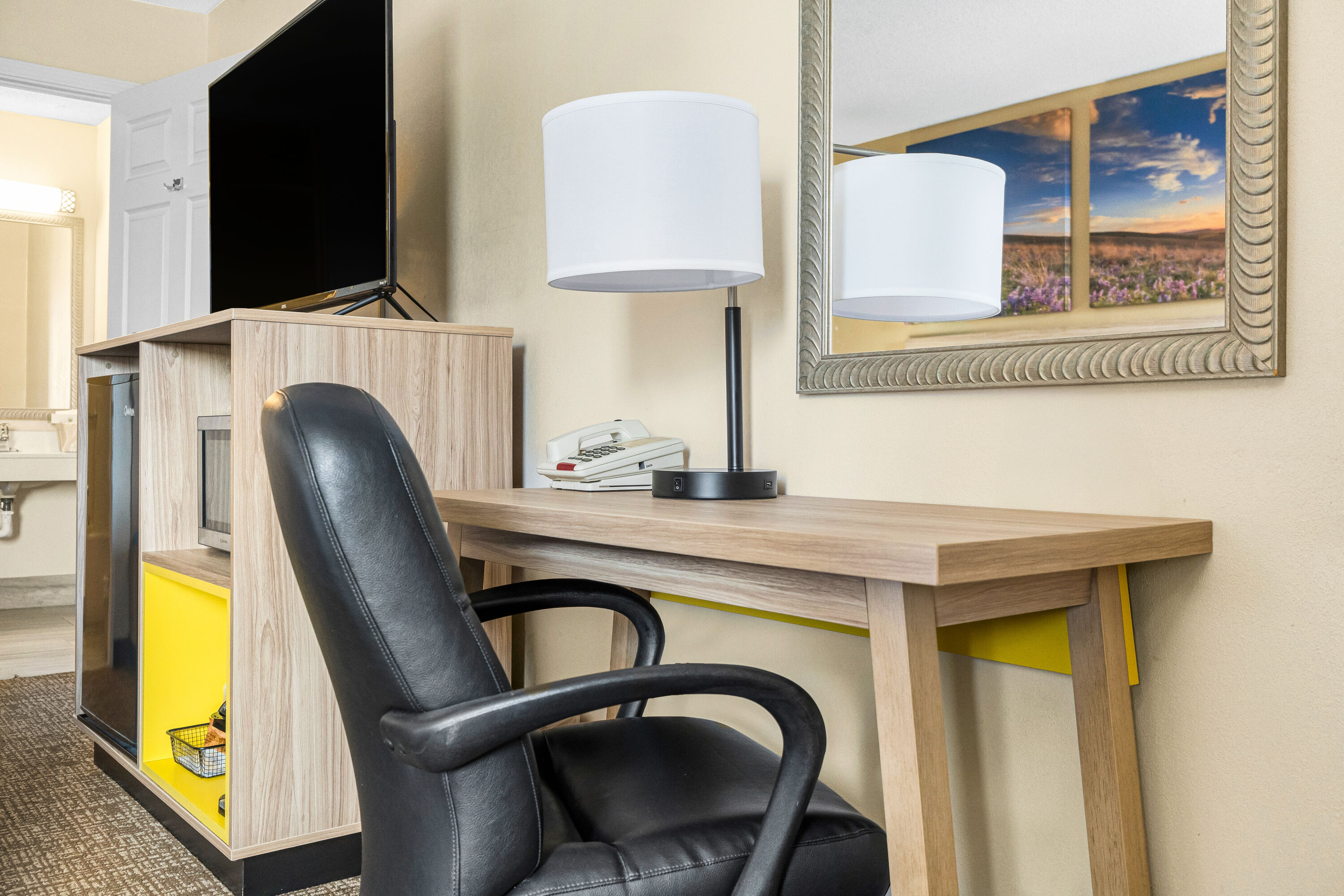 King bed guest room at the Days Inn by Wyndham Fort Wayne in Fort Wayne, Indiana