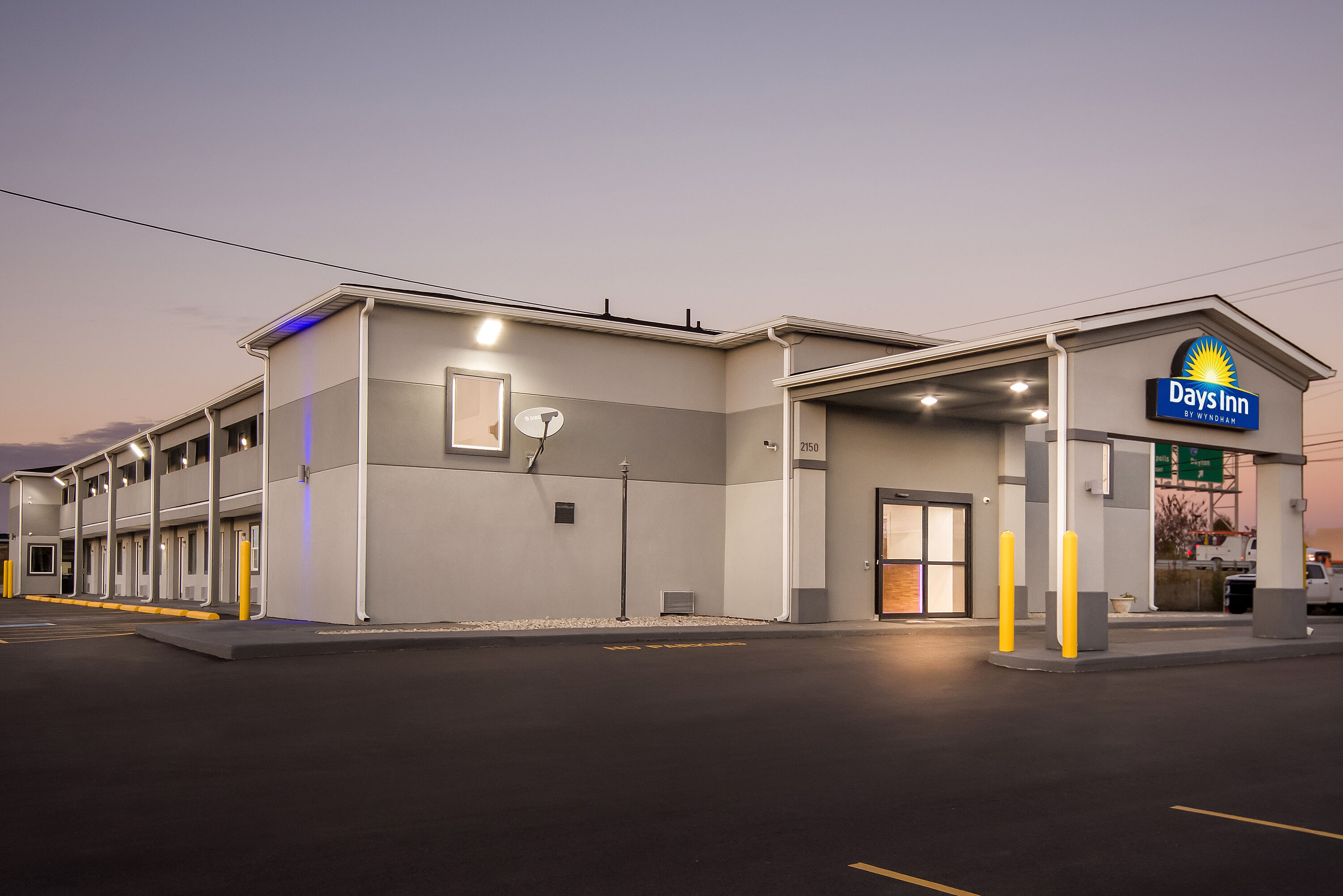 Exterior Night Image of Days Inn by Wyndham Indianapolis East Post Road hotel in Indianapolis, Indiana