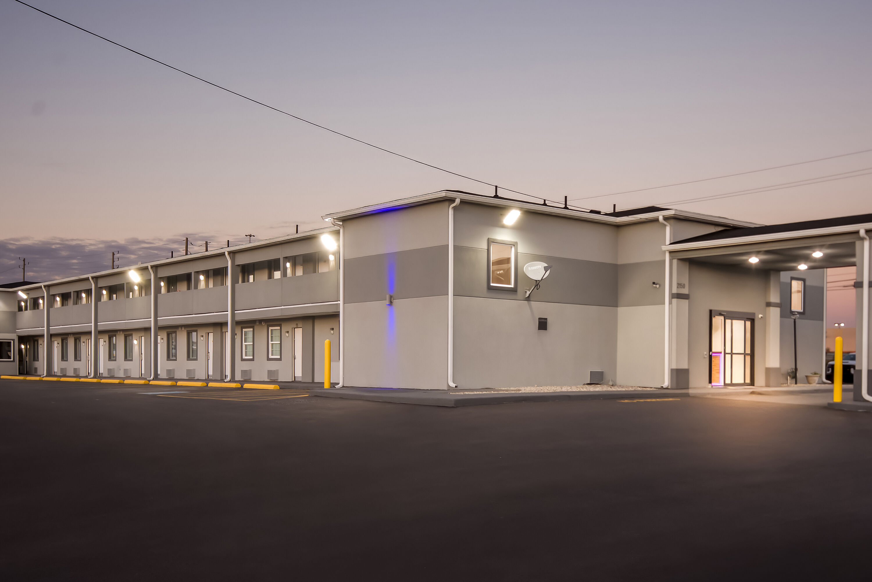 Exterior Night Image of Days Inn by Wyndham Indianapolis East Post Road hotel in Indianapolis, Indiana