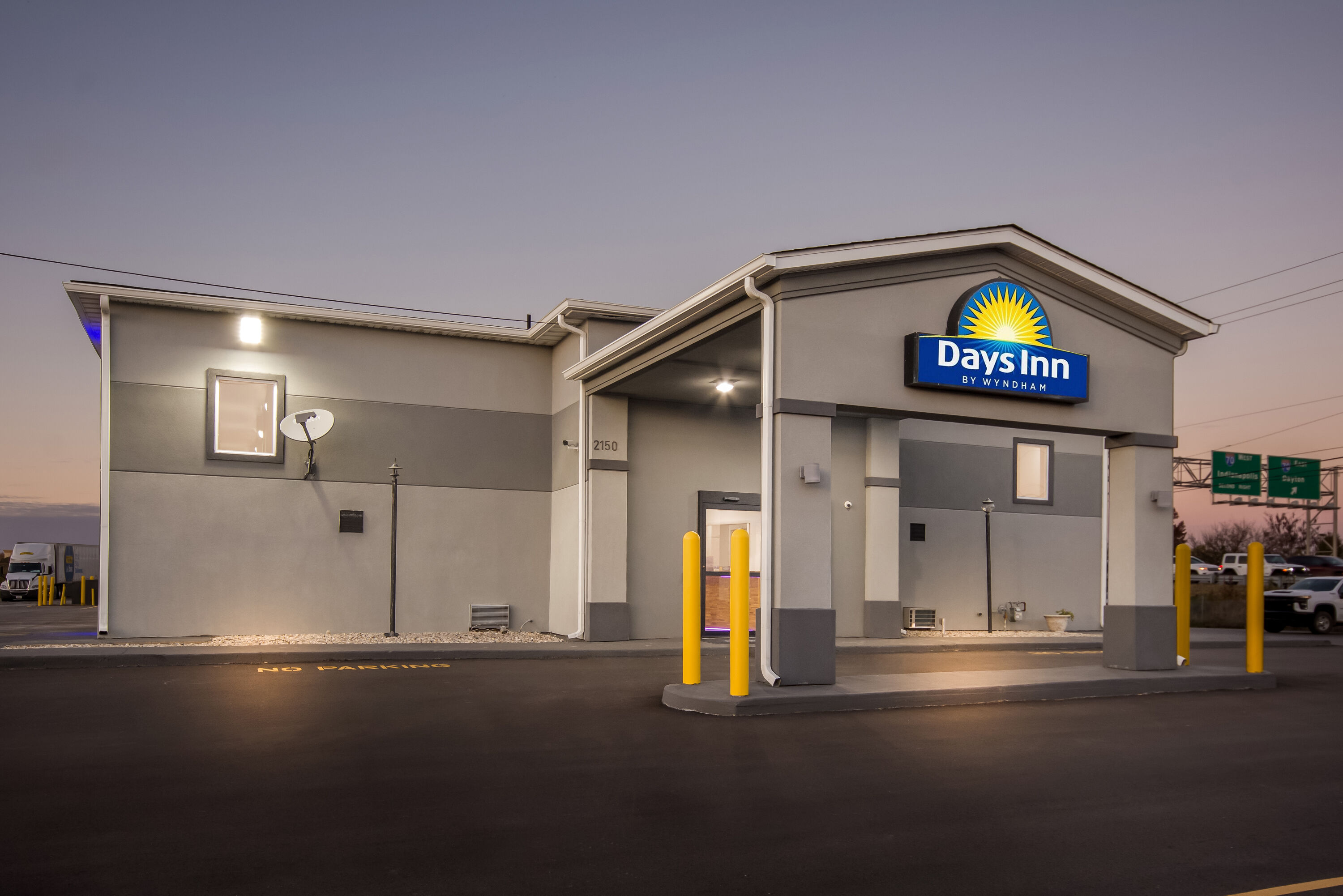 Exterior Night Image of Days Inn by Wyndham Indianapolis East Post Road hotel in Indianapolis, Indiana