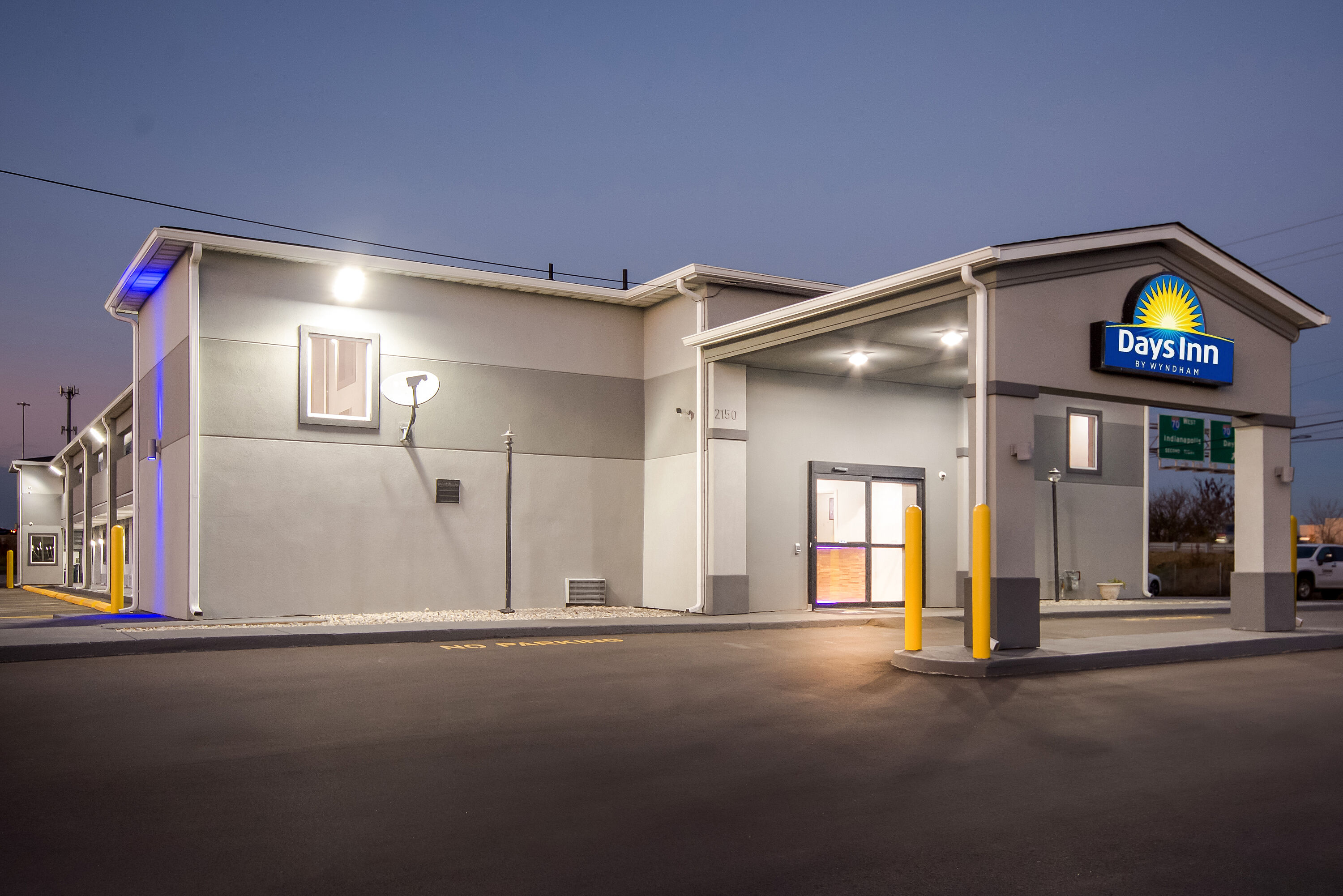 Exterior Night Image of Days Inn by Wyndham Indianapolis East Post Road hotel in Indianapolis, Indiana